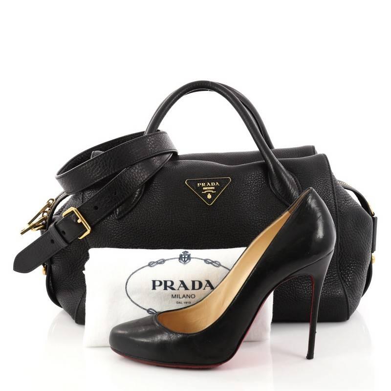 This authentic Prada Convertible Top Handle Satchel Vitello Daino Medium is a perfect companion for daily excursions. Crafted from nero black leather, this satchel features dual-rolled leather handles, Prada Milano logo, and gold-tone hardware