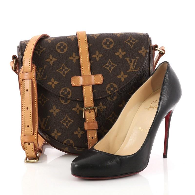 This authentic Louis Vuitton Chantilly Handbag Monogram Canvas PM is a perfect everyday crossbody bag. Constructed from Louis Vuitton's durable and iconic brown monogram coated canvas, this bag features adjustable leather strap, a front flap buckle