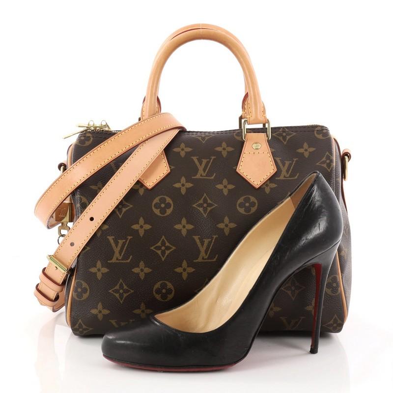 This authentic Louis Vuitton Speedy Bandouliere Bag Monogram Canvas 25 is a classic accessory made for everyday use. Crafted from brown monogram coated canvas, this speedy features dual-rolled vachetta leather handles, vachetta leather trims, yellow