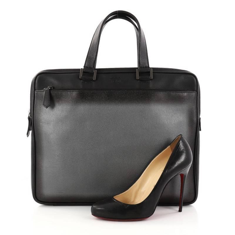 This authentic Fendi Front Zip Briefcase Leather is a chic and functional work-travel accessory made for stylish professionals. Crafted from black leather, this briefcase features dual-flat leather handles, exterior front zip pocket, stamped fendi