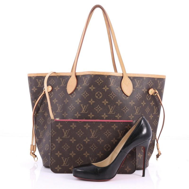 This authentic Louis Vuitton Neverfull NM Tote Monogram Canvas MM is a perfect companion for daily excursions. Crafted from signature brown monogram coated canvas, this iconic easy-to-carry bag features natural cowhide leather trims, dual tall