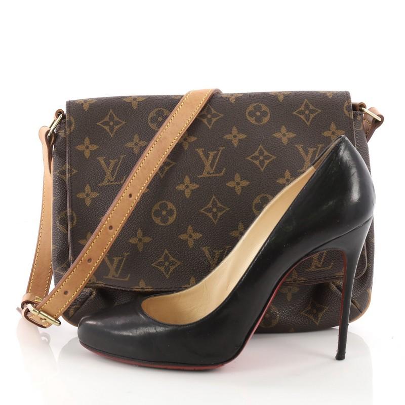 This authentic Louis Vuitton Musette Tango Handbag Monogram Canvas is the perfect bag for any casual chic outfit. Crafted with brown monogram coated canvas, this simple bag features a full flap, adjustable cowhide leather strap for added versatility