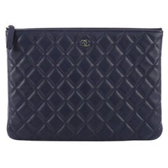 Chanel O Case Clutch Quilted Lambskin Medium
