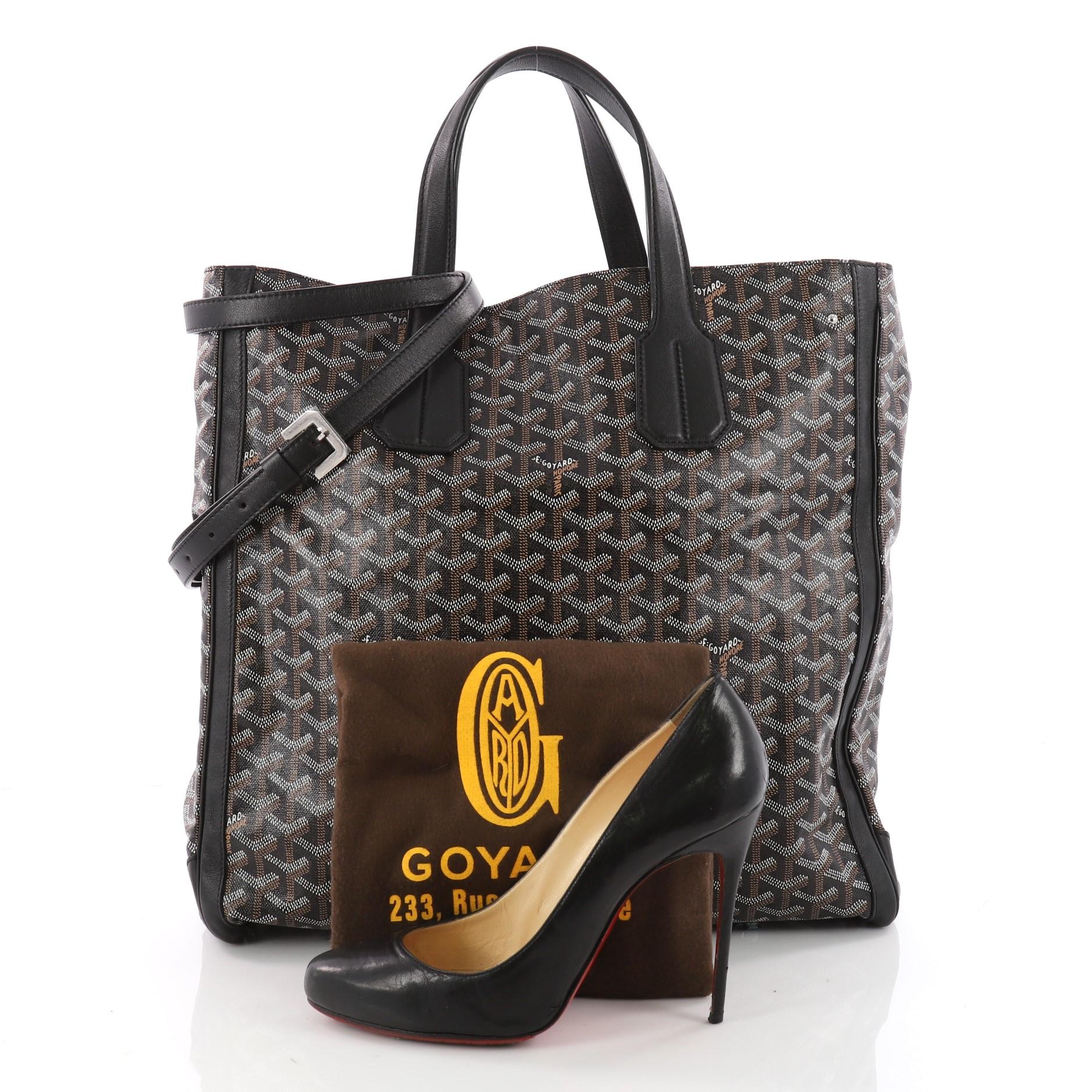 This authentic Goyard Voltaire Convertible Tote Coated Canvas displays a luxurious and casual sophistication perfect for the style-conscious man or woman. Crafted from classic black chevron coated canvas, this tote features dual-flat handles, long