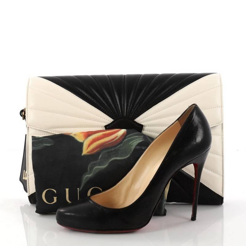 This authentic Gucci Queen Margaret Clutch Colorblock Leather is a new iconic bag perfect to add to your collection. Crafted in black and white leather, this gorgeous bag features an embossed 