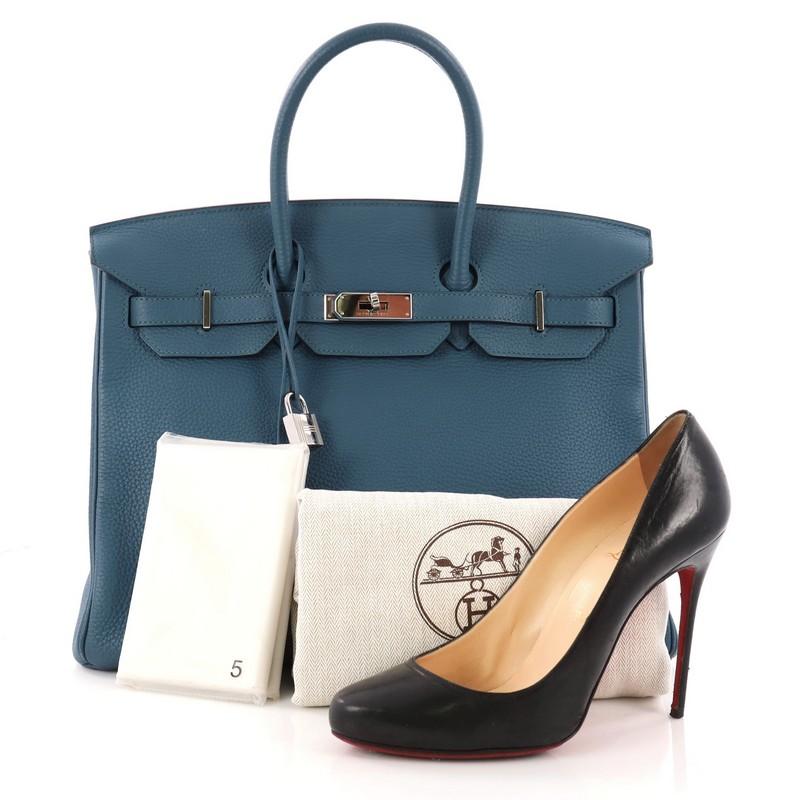 This authentic Hermes Birkin Handbag Bleu Thalassa Togo with Palladium Hardware 35 stands as one of the most-coveted bags fit for any fashionista. Constructed from sturdy, scratch-resistant Bleu Thalassa togo leather, this stand-out oversized tote
