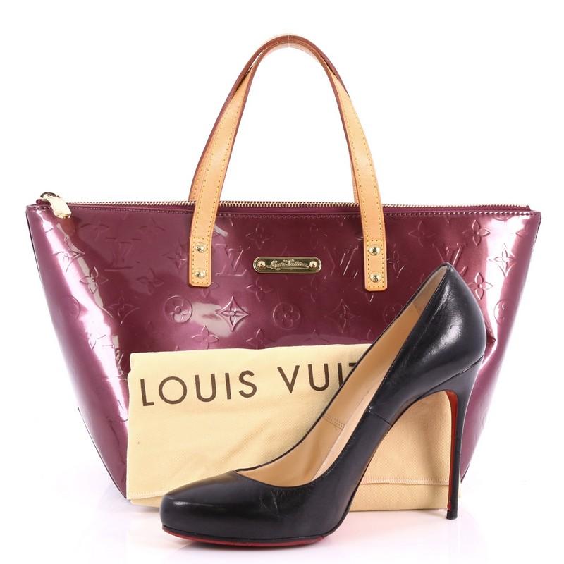 This authentic Louis Vuitton Bellevue Handbag Monogram Vernis PM is a stylish yet functional tote perfect for everyday use. Crafted from Louis Vuitton's purple monogram vernis leather, this chic tote features dual flat vachetta leather handles,