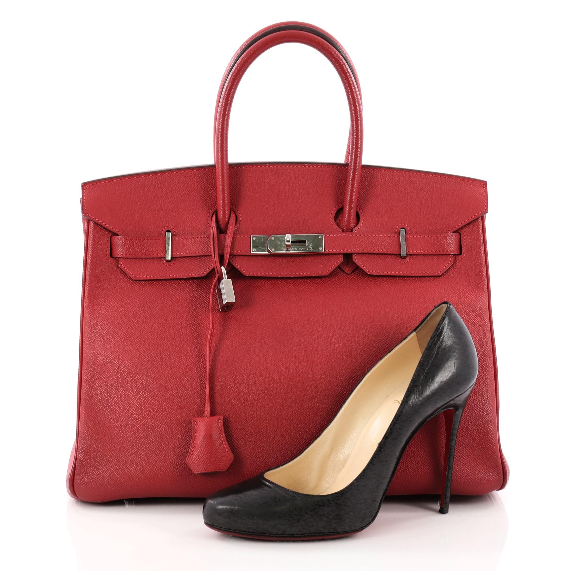 This authentic Hermes Birkin Handbag Rouge Casaque Epsom with Palladium Hardware 35 stands as one of the most-coveted and timeless bags fit for any fashionista. Constructed from scratch-resistant Rouge Casaque Red Epsom leather, this subtly sleek
