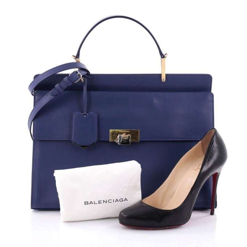 This authentic Balenciaga Le Dix Zip Cartable Top Handle Bag Leather Medium is an iconic and timeless bag beloved by many. Crafted from blue leather, this stylish bag features top leather handle, detachable shoulder strap, snap closure with embossed