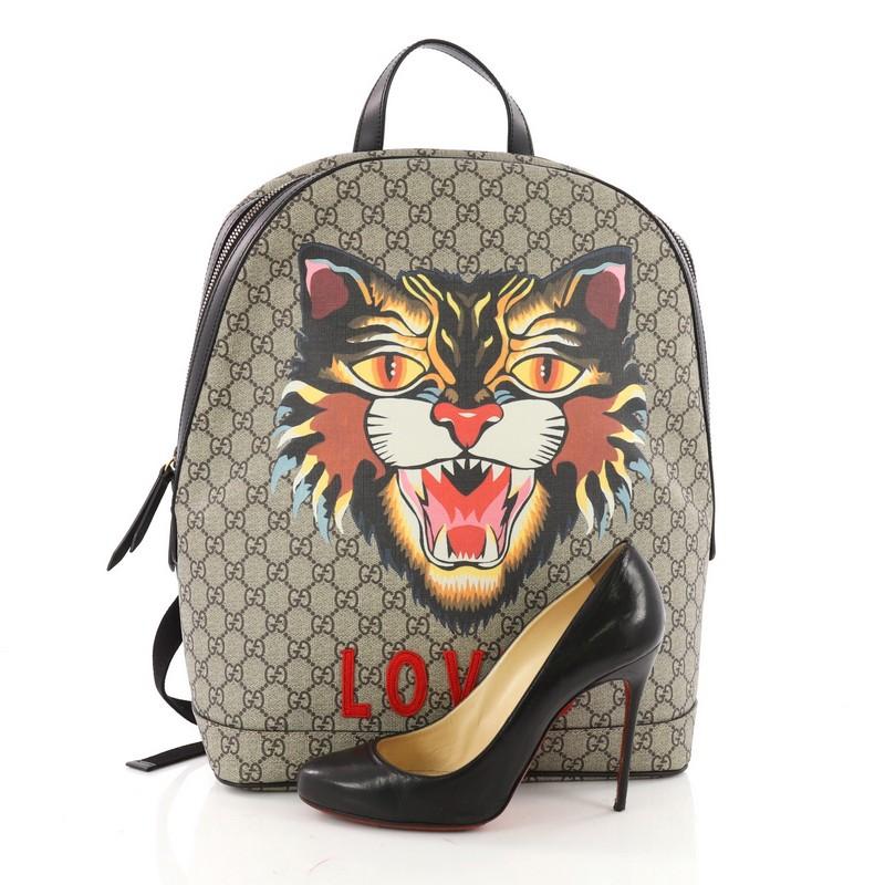 This authentic Gucci Angry Cat Zip Backpack Printed GG Coated Canvas Medium is great for travelling with ultimate hands-free convenience. Crafted in brown GG coated canvas, this eye-catching backpack features an Angry Cat print at front, an