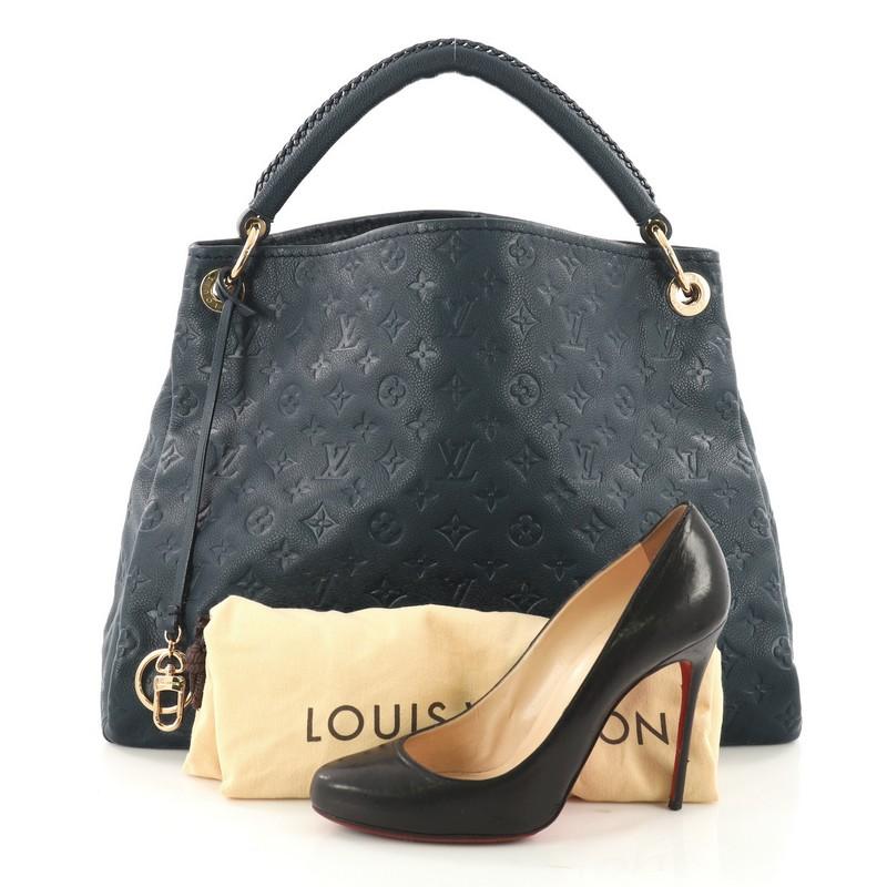 This authentic Louis Vuitton Artsy Handbag Monogram Empreinte Leather MM is an iconic hobo. Crafted from blue monogram embossed empreinte leather, this luxurious and refined hobo features a single looped braided top handle with polished gold links,