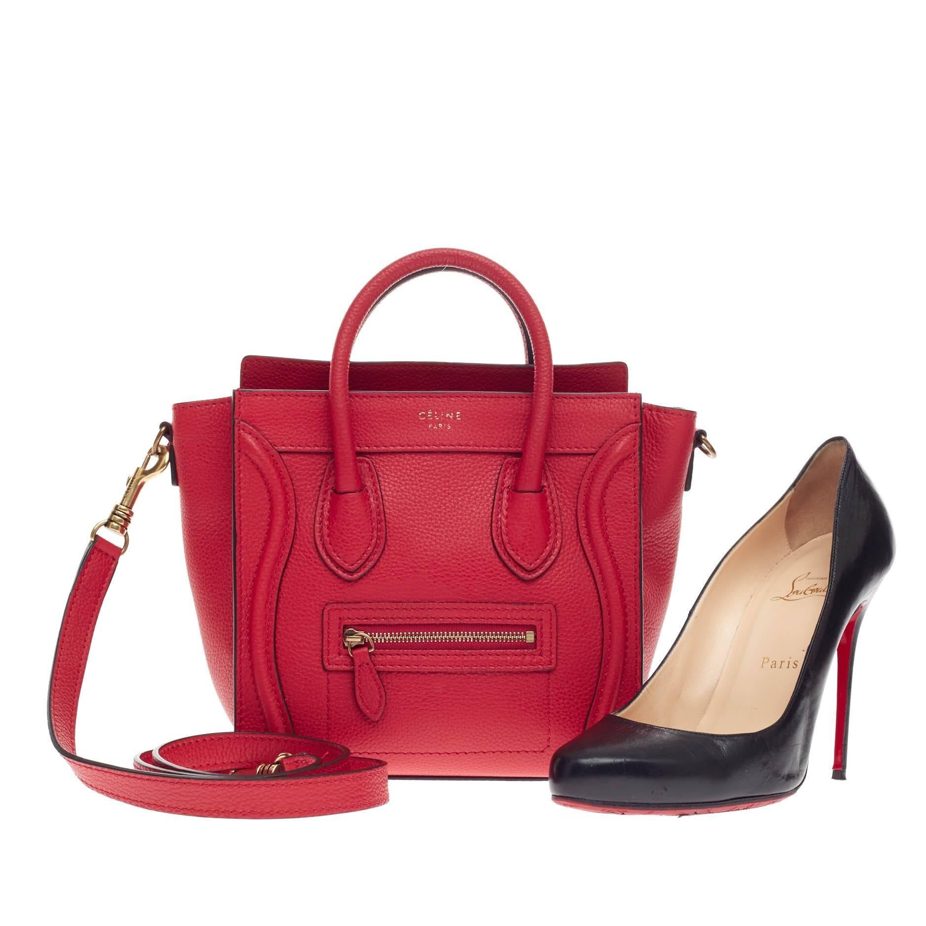 This authentic Celine Luggage Grainy Leather Nano in stunning lipstick red is the smallest of Celine's widely popular Luggage Collection. Its miniature size and long detachable strap make it an effortlessly easy hands-free bag to carry while