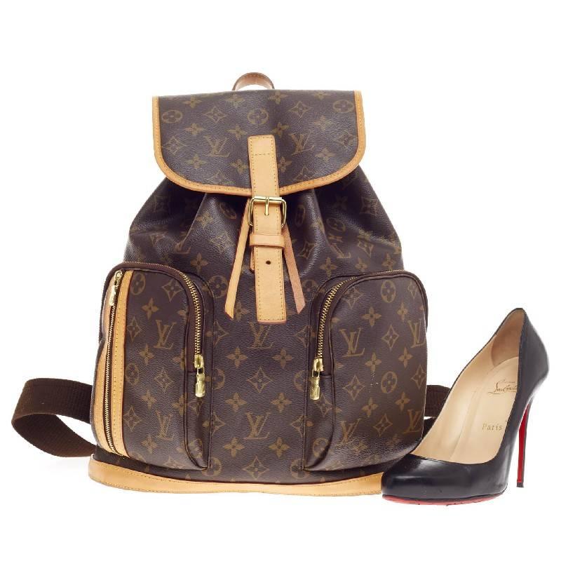 This authentic Louis Vuitton Bosphore Backpack Monogram Canvas is perfect for on-the-go fashionistas. Crafted in Louis Vuitton's brown monogram canvas print with vachetta leather trimmings, this chic backpack features gold-tone hardware accents, two
