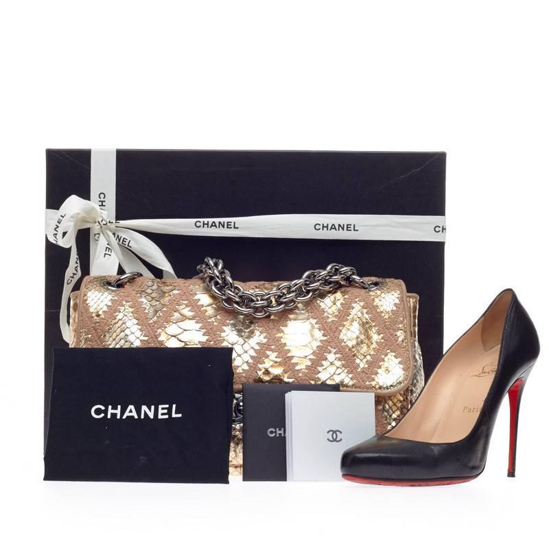 This authentic Chanel Soft and Chain Flap Quilted Python Large is crafted beautifully in luminous metallic silver and gold genuine python skin with taupe crochet stitched accents, perfect for night outs and formal events. This luxurious yet elegant