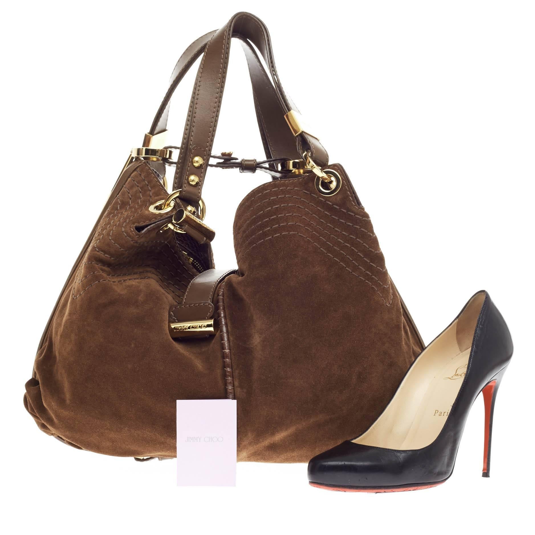 This authentic Jimmy Choo Alex Hobo Suede is perfect for everyday use. Crafted in dark brown suede with contrast detailed stitching and brown leather and snakeskin trimmings, this lush, slouchy hobo features dual-flat handles, contrast stitch