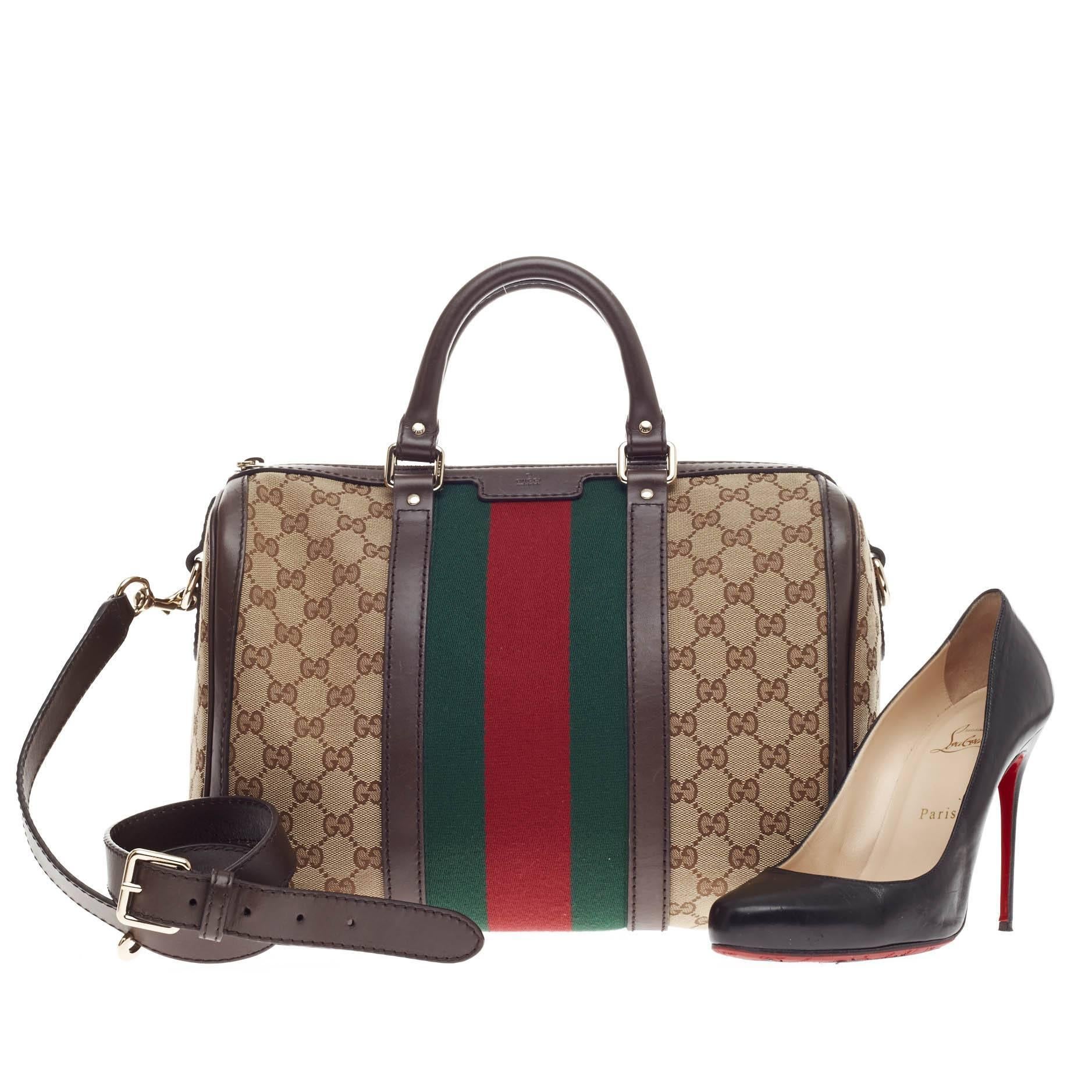 This authentic Gucci Vintage Web Boston Bag GG Canvas Medium is a recognizable classic. Crafted with brown GG canvas with signature green and red web stripes and leather trimmings, this bag features dual-rolled handles, protective base studs, and