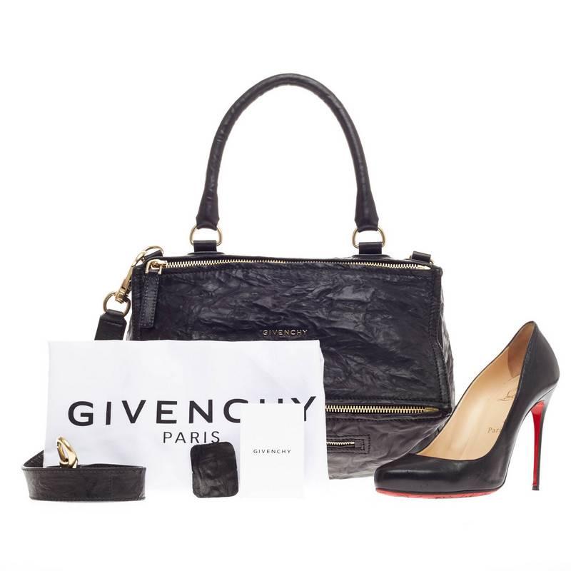 This authentic Givenchy Pandora Bag Distressed Leather Medium is the perfect companion for any on-the-go fashionista. Crafted in black distressed leather, this edgy and cult-favorite satchel features a pandora box-inspired silhouette, a singular top