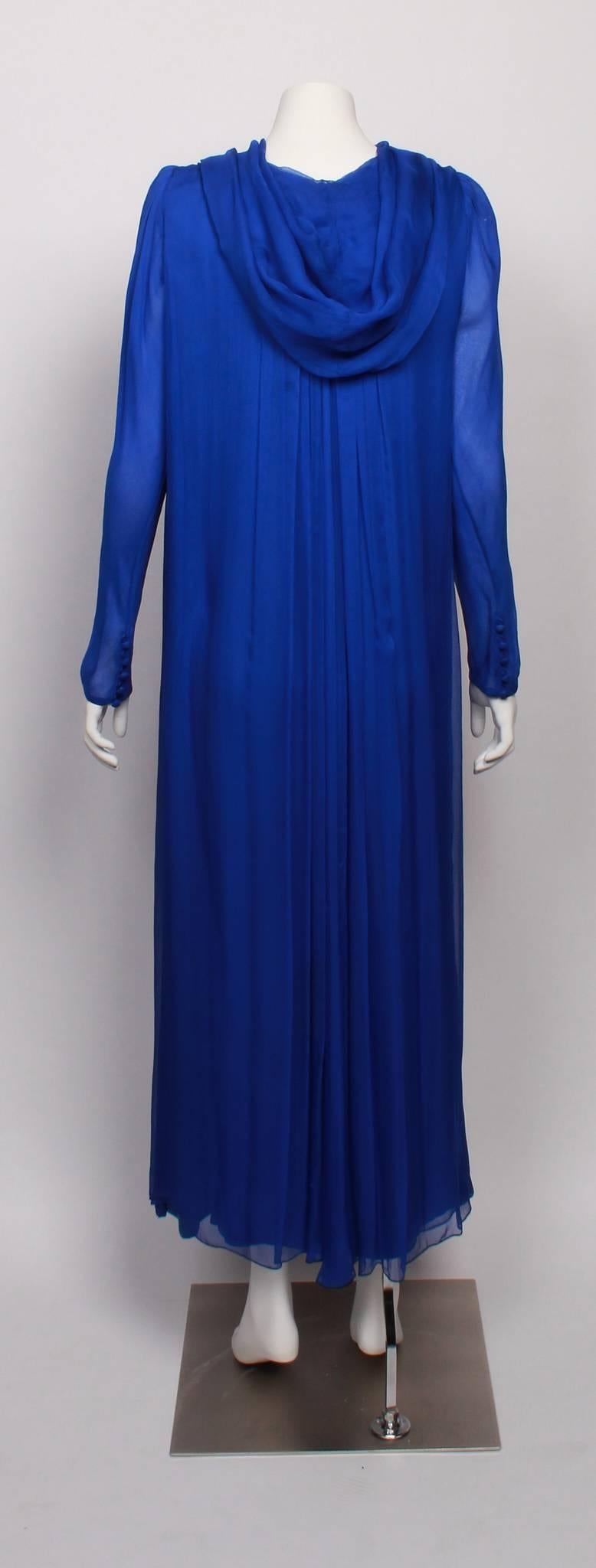  Amazing and rare YVES SAINT LAURENT 1970s Couture  Silk Chiffon Hooded Evening Gown. 
Features YSL unique couture numbering on label.  
Made from textured silk chiffon and fully lined in the famous and classic YSL statement colour  - majorelle