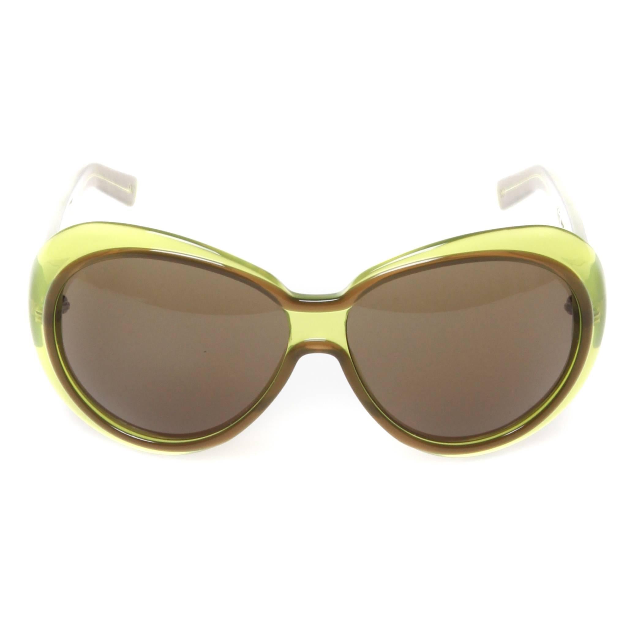 Lime green and brown resin Bottega Veneta oval sunglasses with brown tinted lenses and geometric accents at arms.