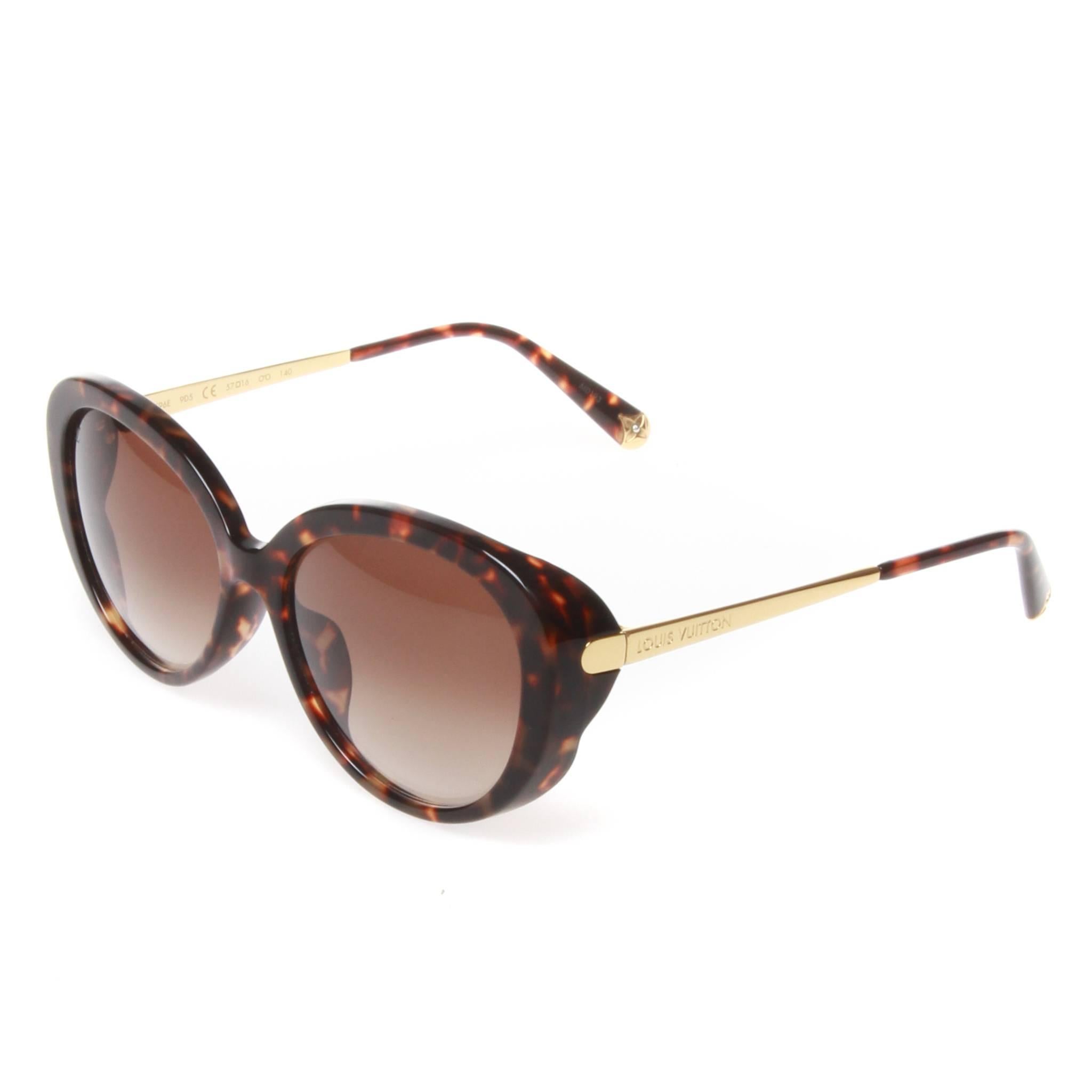 Louis Vuitton Bluebell Sunglasses in an exclusive dark tortoiseshell acetate with goldtone accents. Beautifully rounded and inspired by the floral motifs of the classic Monogram design. The brown gradient lenses are category 2 and provide 100% UV