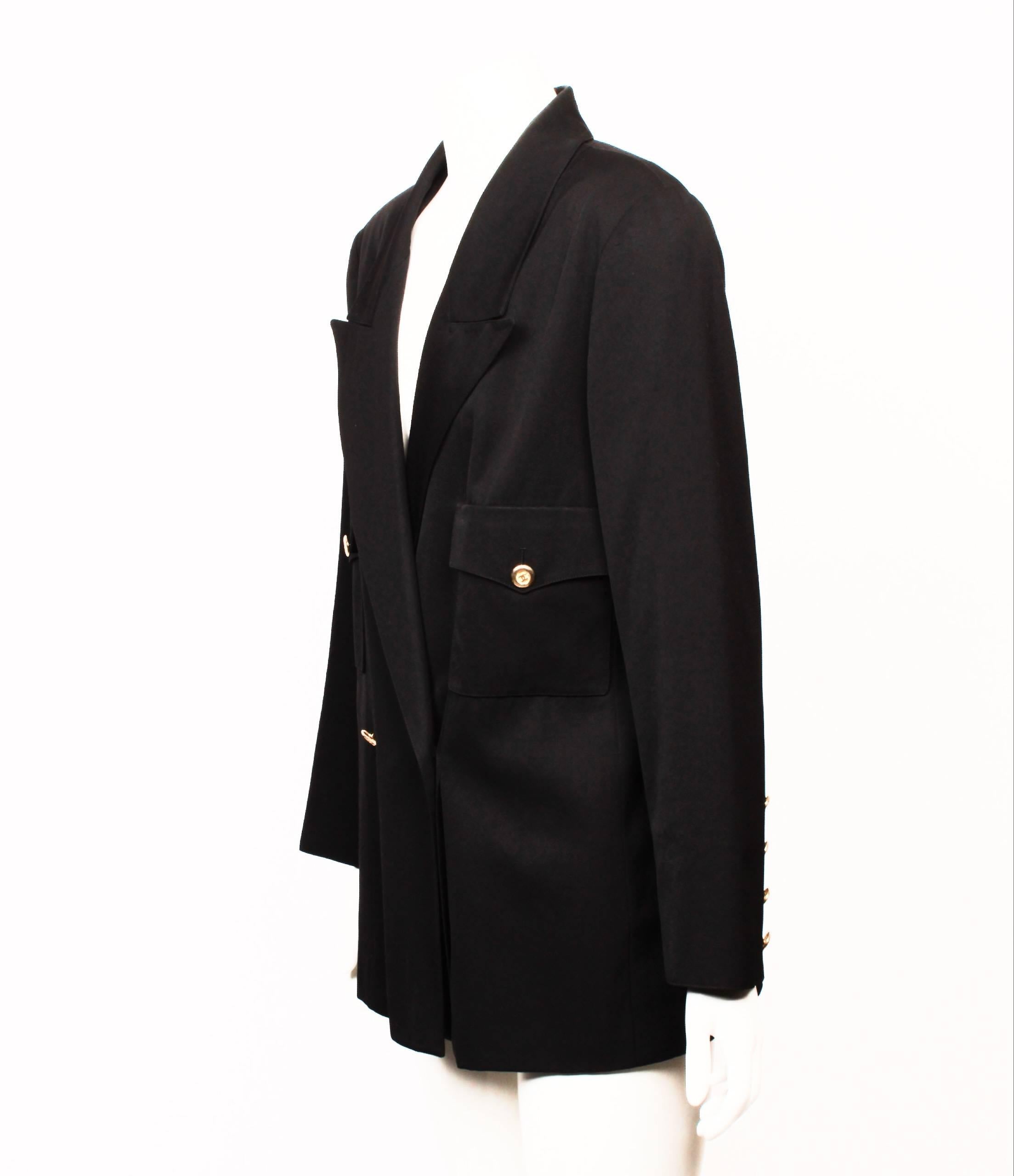 Classic 1980's Chanel black double breasted blazer made from 100% wool with silk lining. 
Gorgeous golden CC logo buttons on front closure and sleeve vent. This item has an original factory hand written sample label attached. Made in France. Size