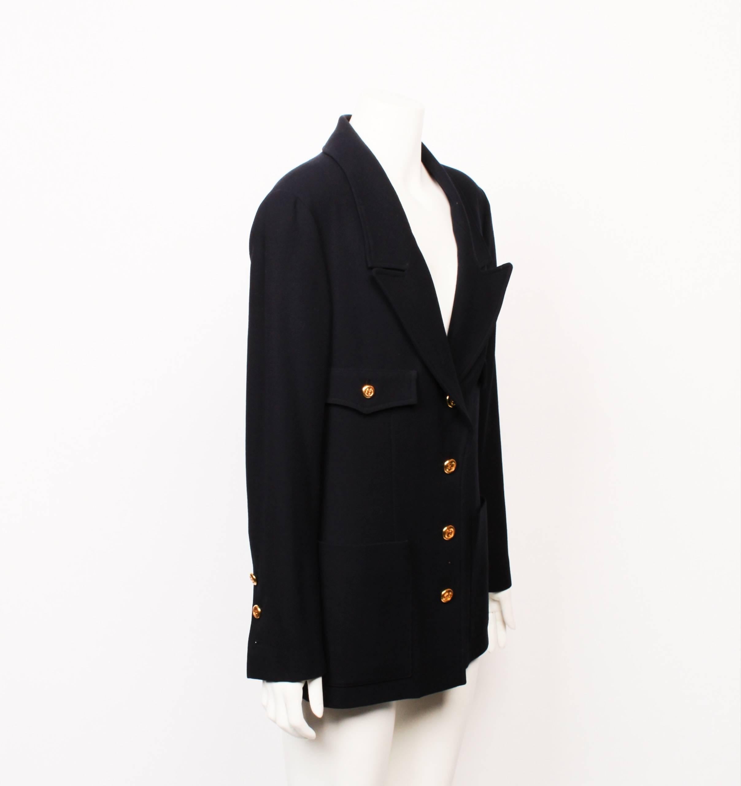 Classic 1990s Chanel navy blue single breasted blazer made from 100% wool with silk lining. 
Gorgeous golden CC logo buttons on front closure and sleeve vent. Features four patch pockets. There are 2 buttons missing on the sleeves. 
 Made in France.