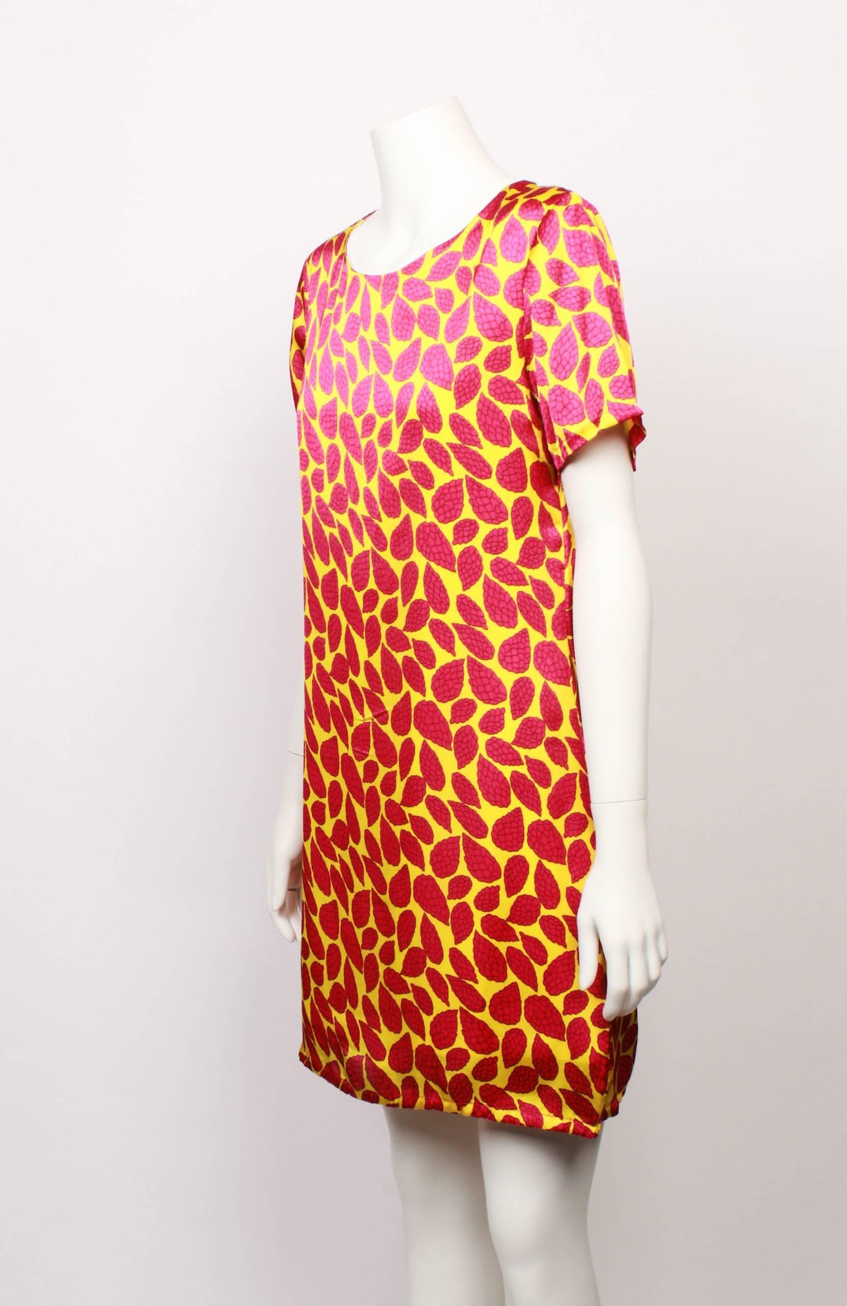 Love Moschino 100% pure silk shift dress . The print has a bright yellow base with a bright fuschia leaf design. Fully lined with feature black and nickel zipper closure. Original swing tag is attached. 