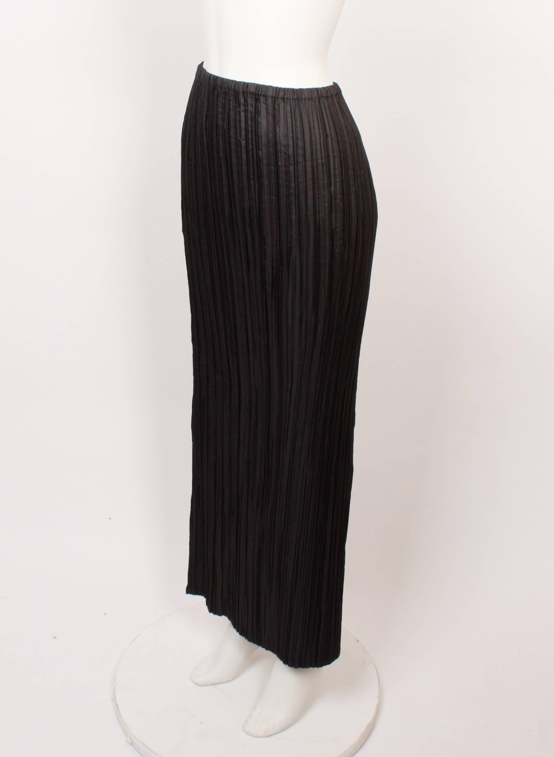 1990s Issey Miyake long black pleated skirt with elasticated waist in iconic Issey Miyake pleats. 
Fabric is stretchy and measurements are with garment flat and un-stretched. 