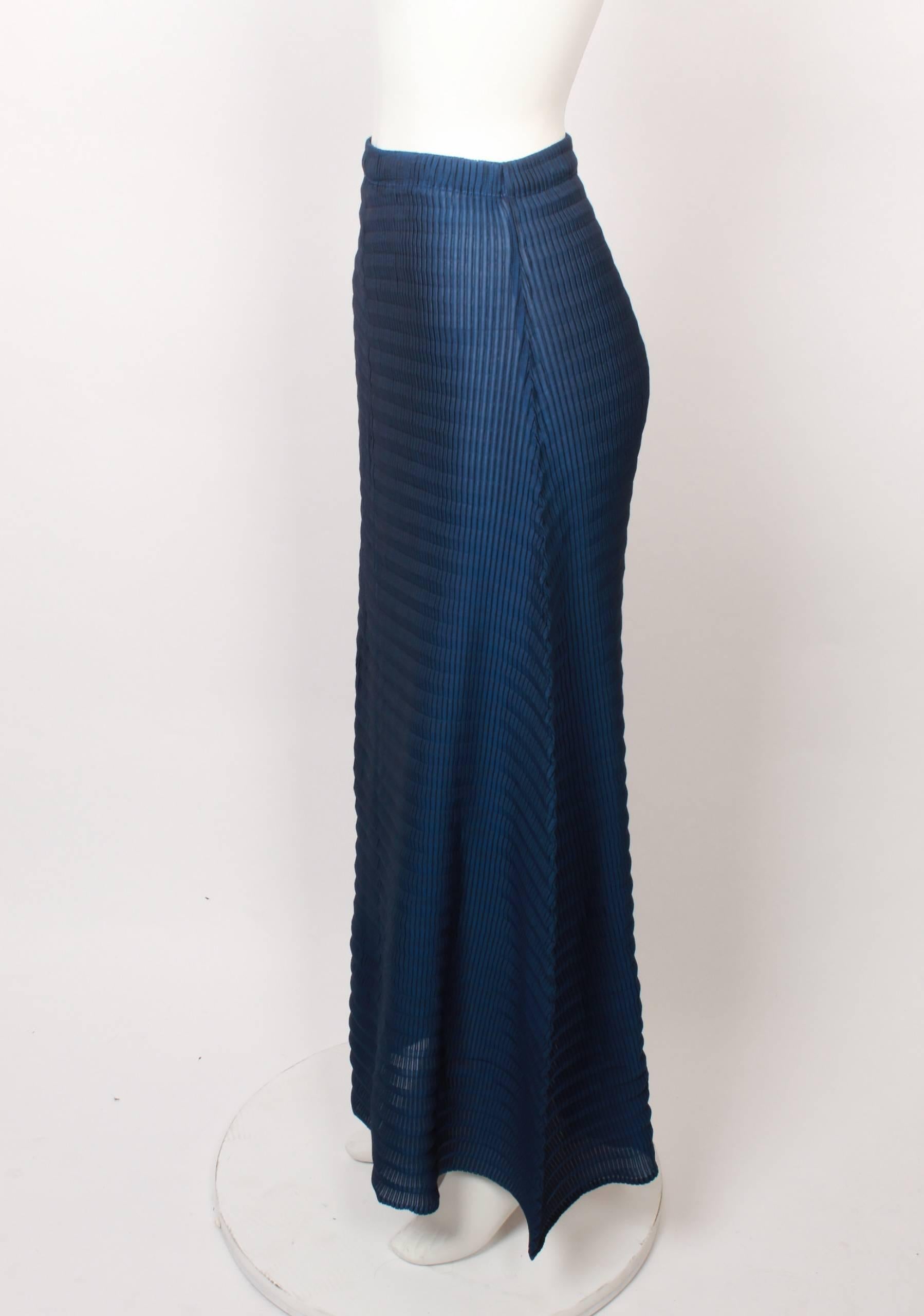 Beautiful blue 1990s Issey Miyake White Label A-line maxi skirt with elasticated waist in iconic Issey Miyake pleats. Pleated in both a vertical and horizontal direction. 
Fabric is stretchy and measurements are with garment flat and un-stretched.