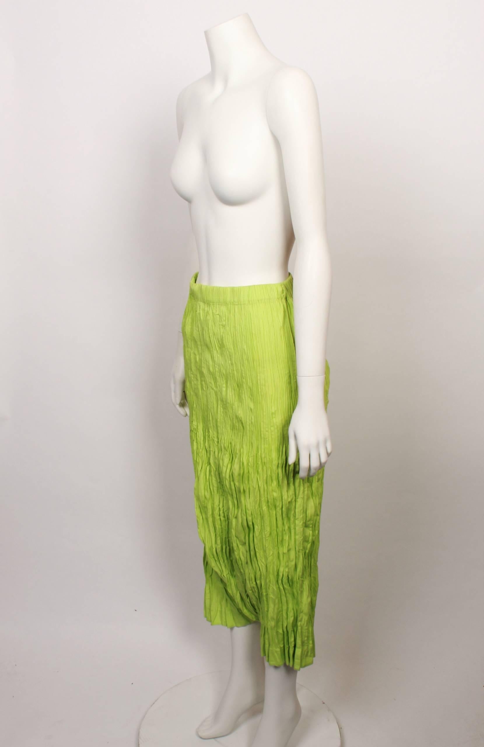 1990s Issey Miyake 3/4 length lime green drop crotch pants with elasticated waist in iconic Issey Miyake pleats. 
Fabric is stretchy and measurements are with garment flat and un-stretched. 
