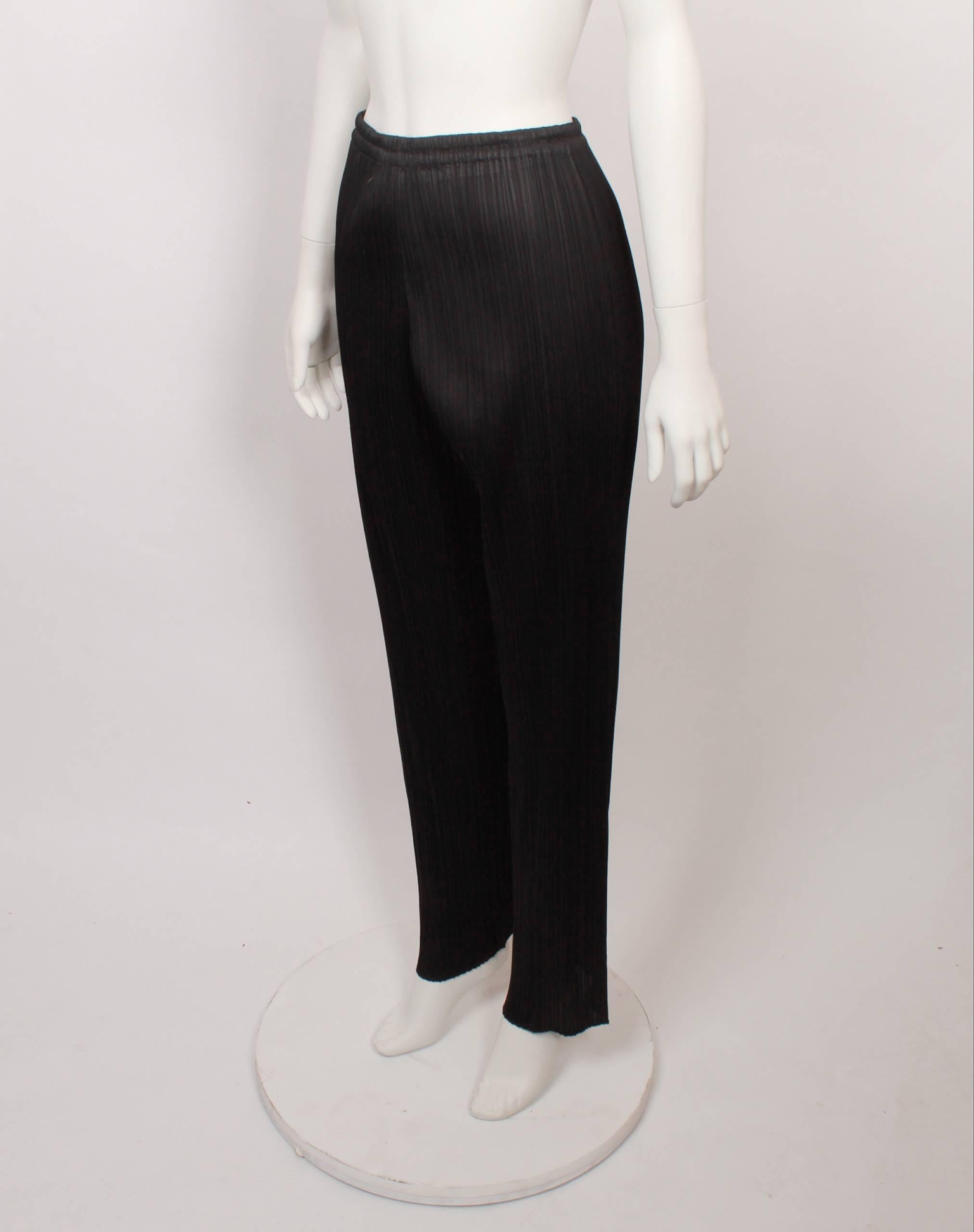 1990s Issey Miyake Pleats Please black pants with elasticated waist in iconic Issey Miyake pleats. 
Fabric is stretchy and measurements are with garment flat and un-stretched. 