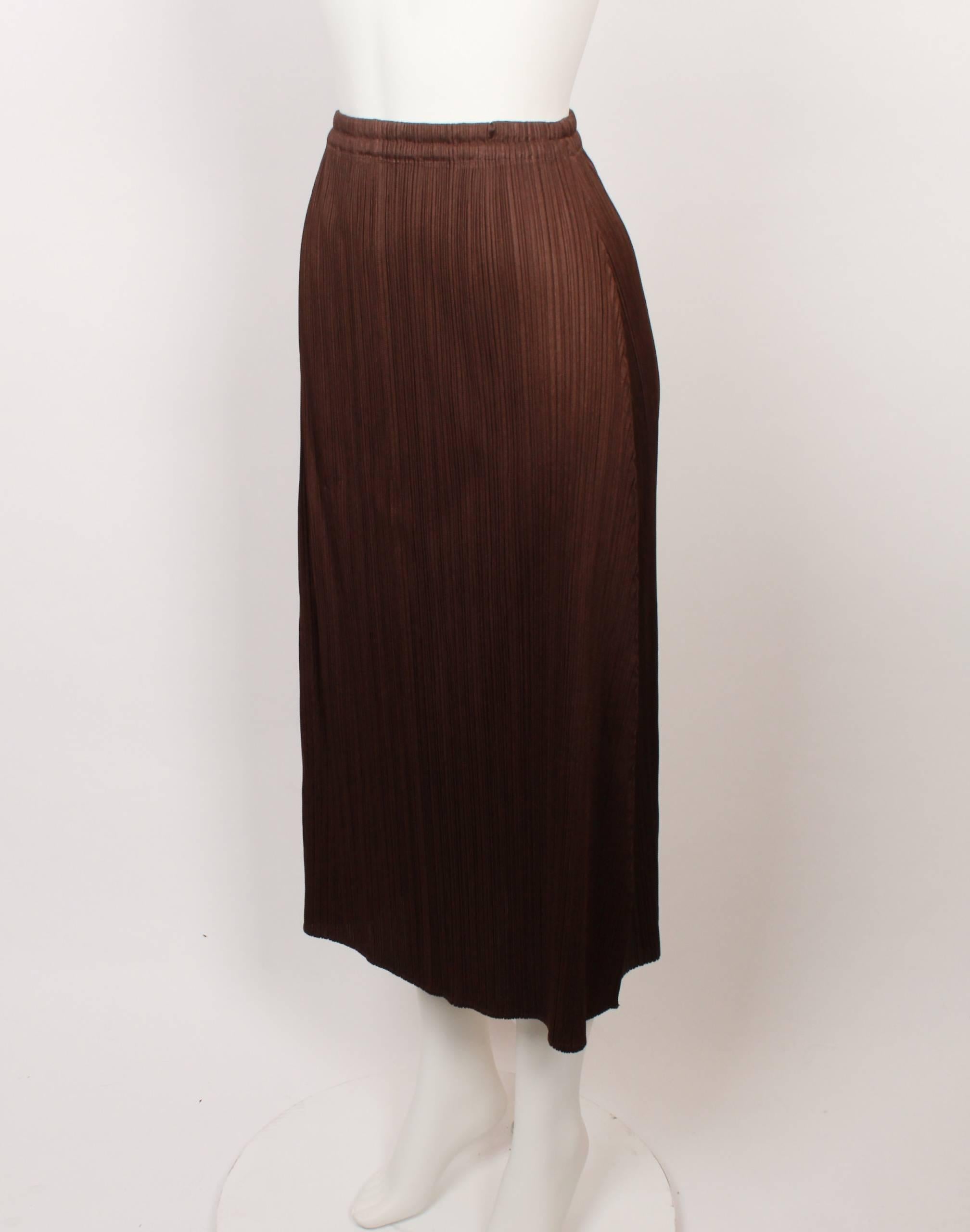 1990s Issey Miyake 3/4 length brown pleated skirt with elasticated waist in iconic Issey Miyake pleats. 
Fabric is stretchy and measurements are with garment flat and un-stretched. 
