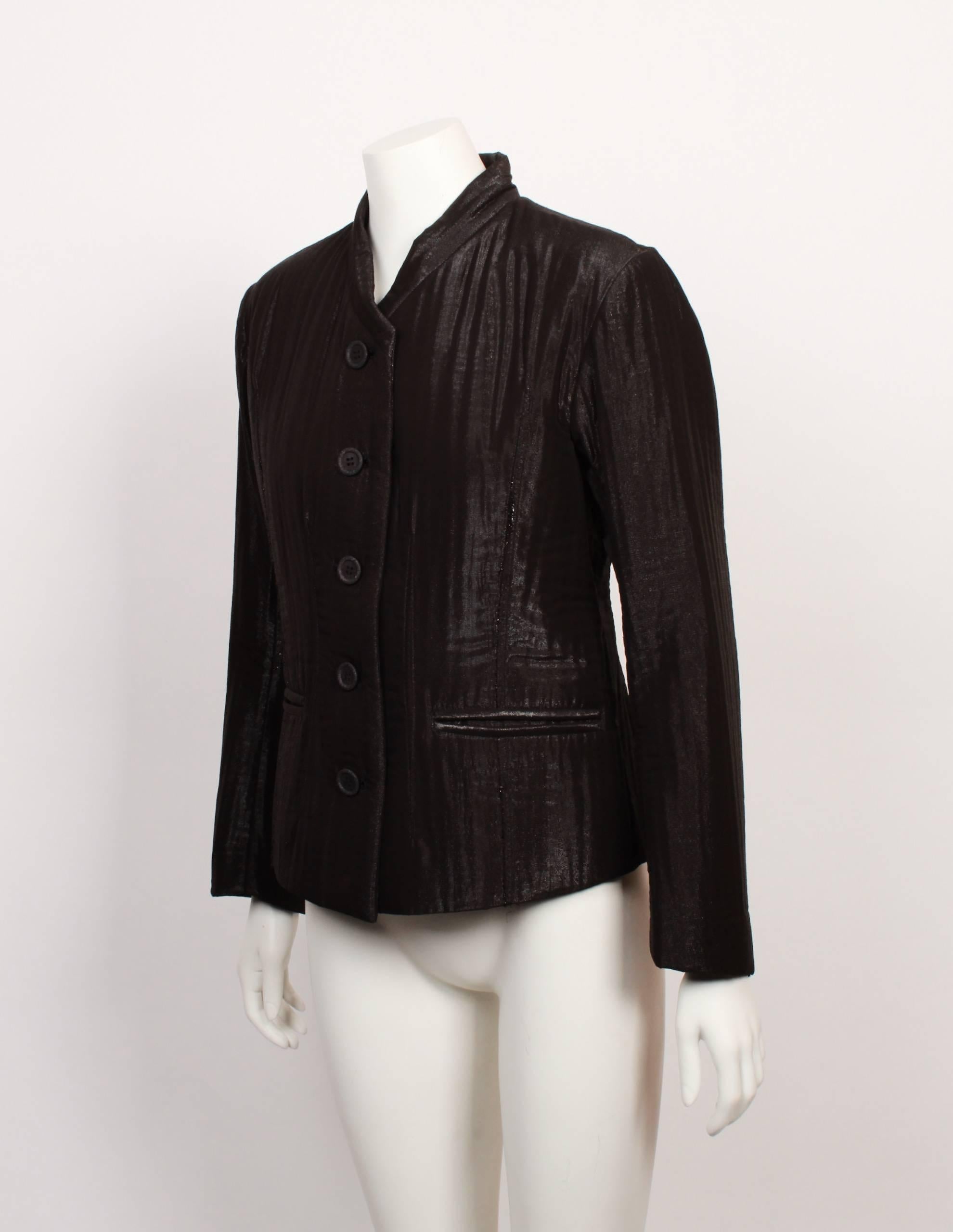 Issey Miyake tailored single breasted jacket with mandarin collar and welt pockets.  Fitted silhouette and constructed from very unusual shot brown fabric that has an almost shimmer effect. 
Made in Japan. Size S
