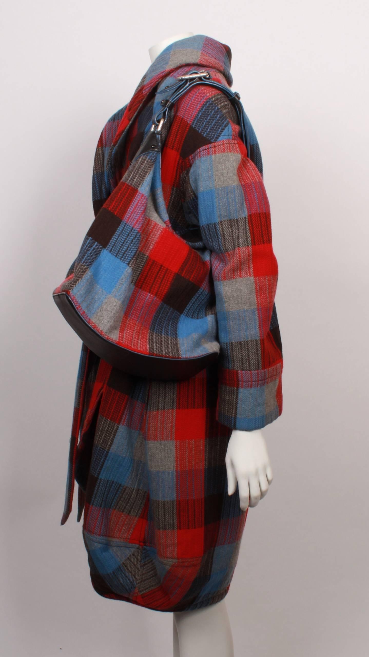 Marc Jacobs black, red, grey and blue checked wool flannel wrap coat & matching shoulder bag. 
Coat has roll collar, bubble hemline and wide tie belt. 
Bag measures 29cmH x 39cmW x 15cmD and features outside zip pocket, inside zip pocket and
