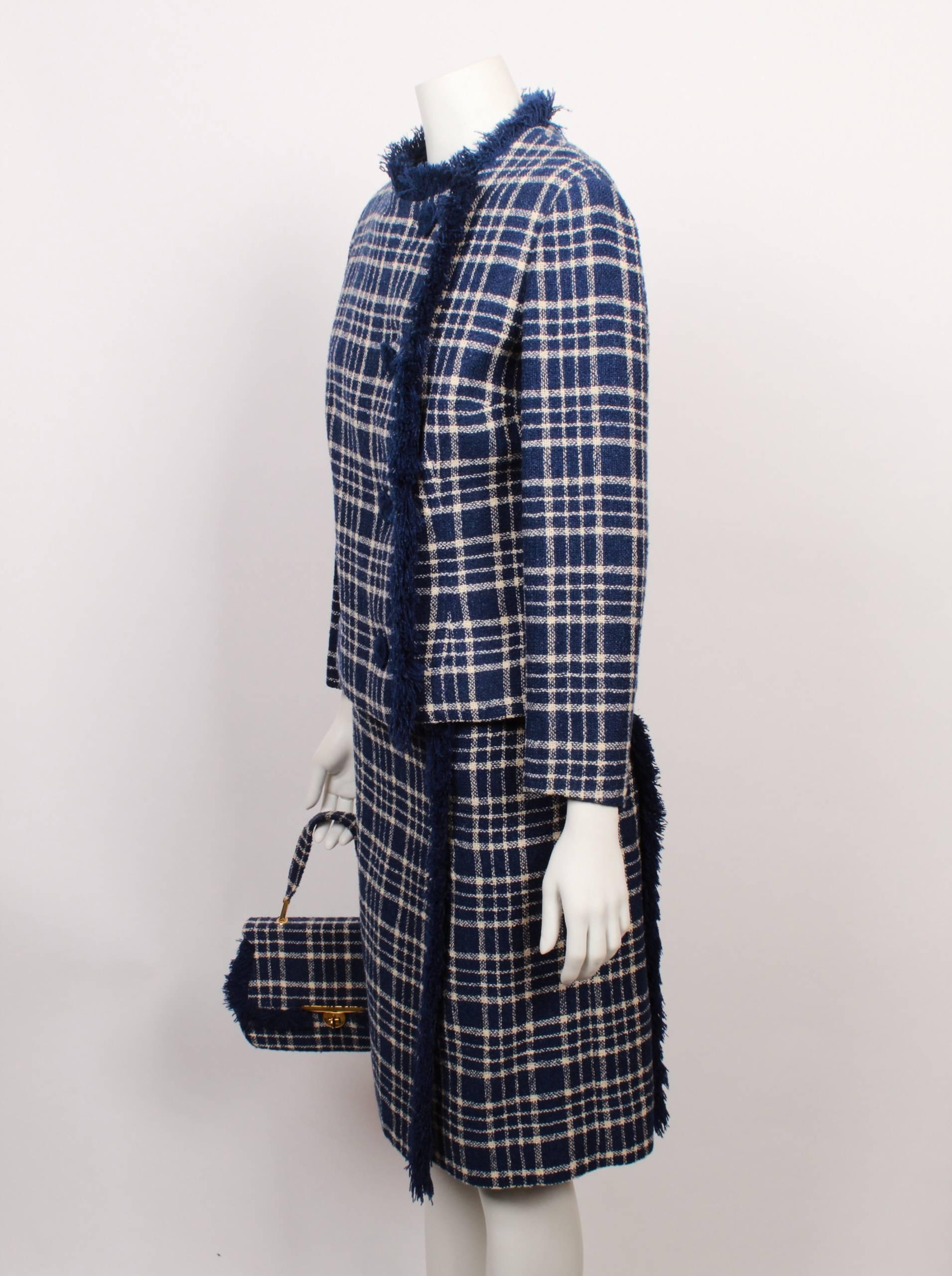 Amazing Le Louvre Melbourne couture blue and white checked tweed 3 piece ensemble consisting of a jacket, skirt and matching self fabric hand bag. 
Made in the 1960s from imported European fabric by the famous Melbourne boutique Le Louvre. Most