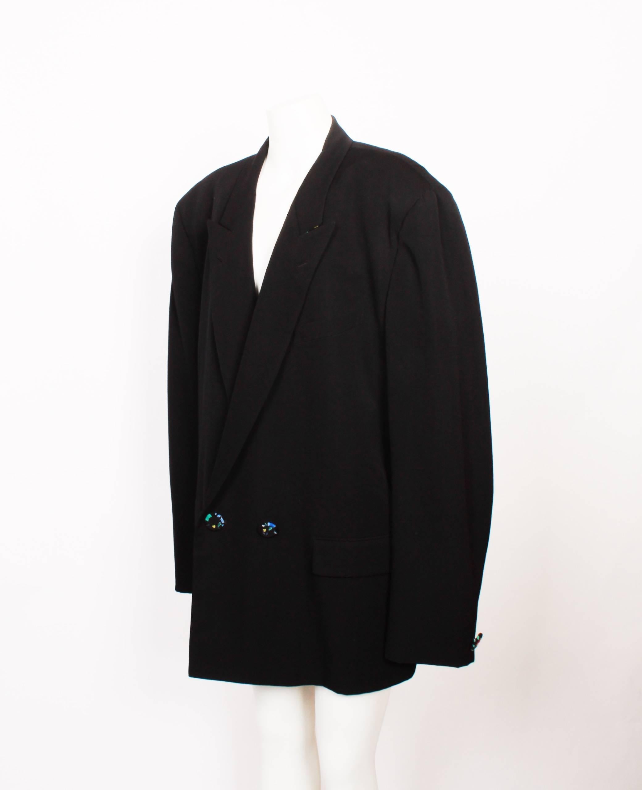 Black Comme des Garcons Blazer featuring printed floral button design, with matching floral collar detailing on underside. Size Large.


Comme des Garçons headed by Rei Kawakubo  is regarded by many in the fashion industry as a leader of innovative