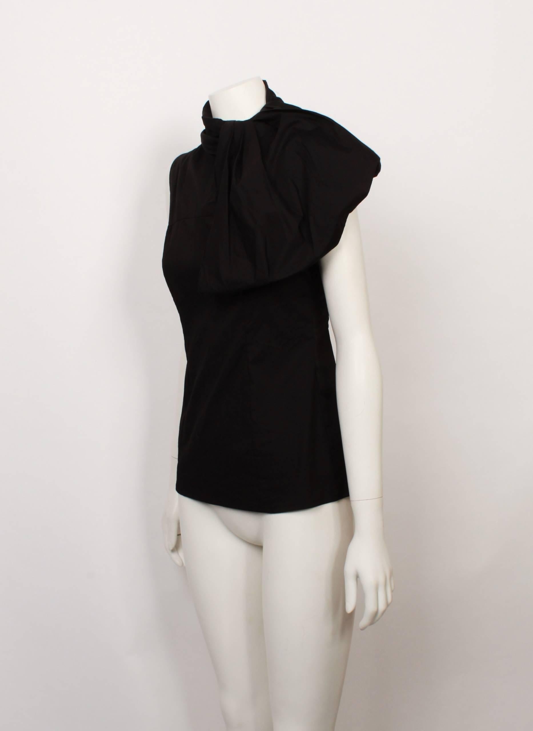 Prada black cotton sleeveless shell top with exaggerated side cravat. Fitted silhouette and back invisible zipper. Made in Italy. size 40. Fabric has slight stretch.
