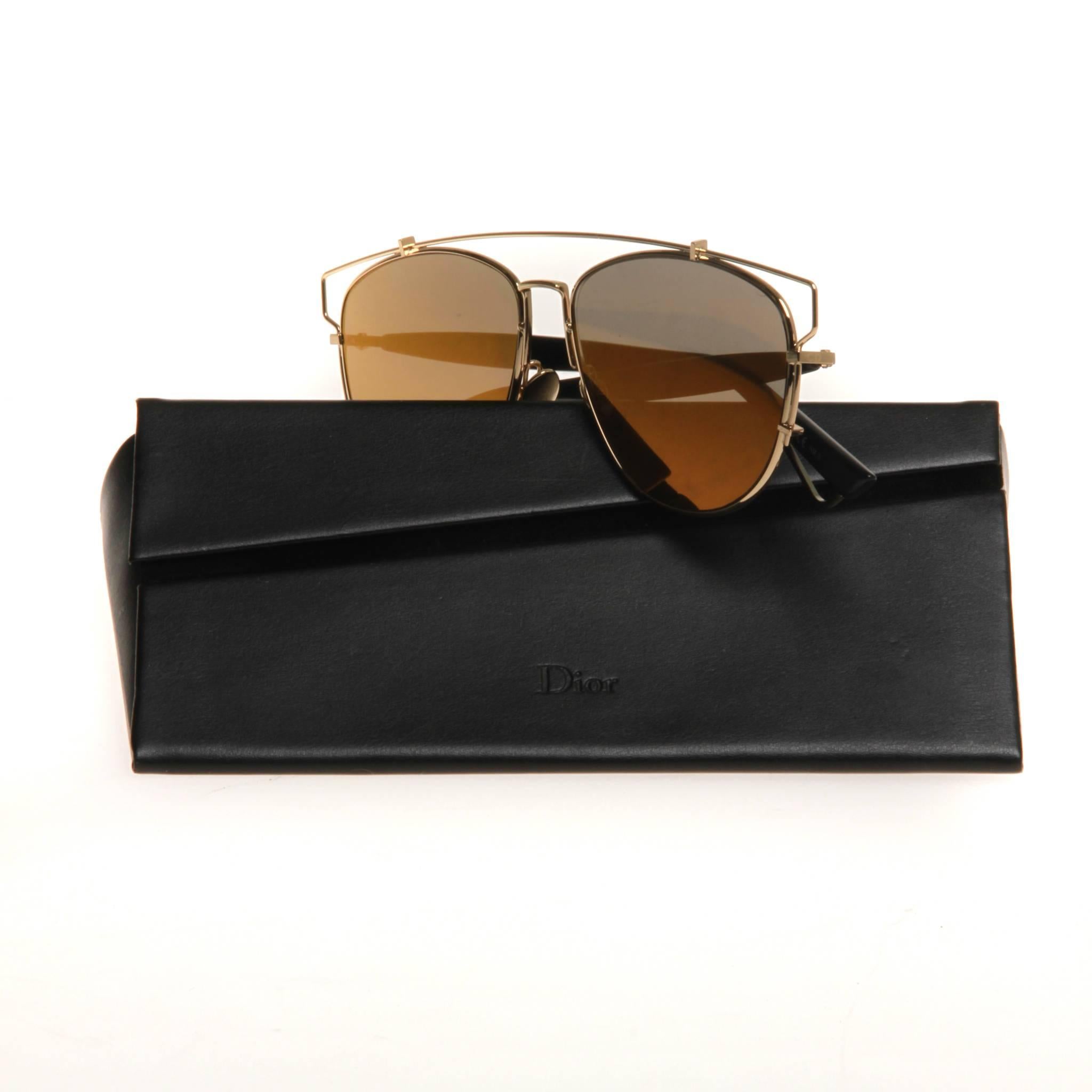 Gold-tone metal Christian Dior Technologic aviator sunglasses with tinted and reflective lenses and logo accents at temples. Includes case. 