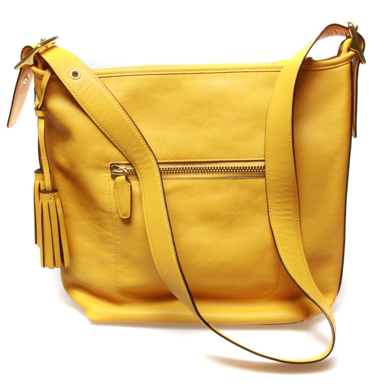 Coach large ladies yellow handbag duffle crossbody with dust cover and gold hard at 1stdibs