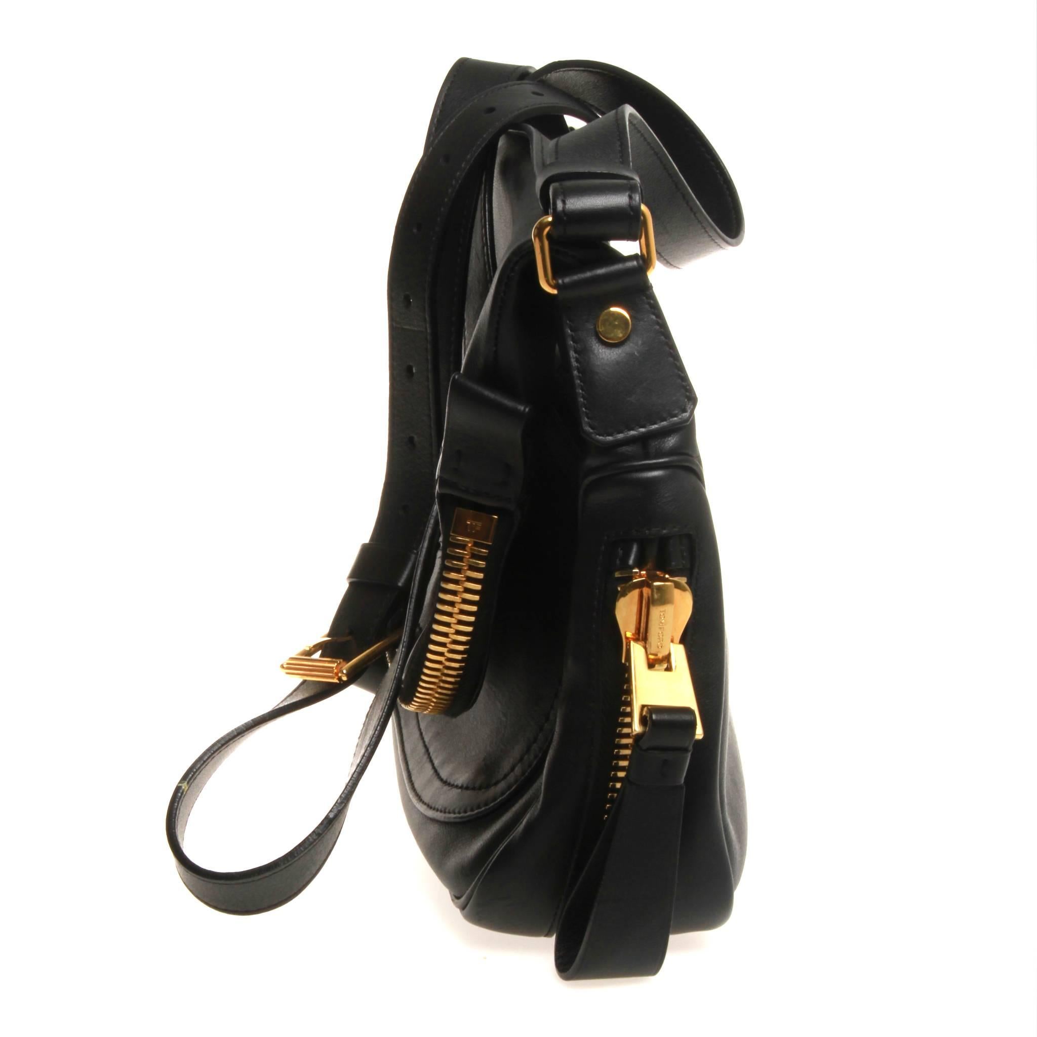 Black grained leather Tom Ford Medium Jennifer bag with gold-tone hardware, adjustable shoulder strap, zip expansion at perimeter, dual pockets at exterior; one with zip closure, black suede interior, single pocket at interior wall with zip closure