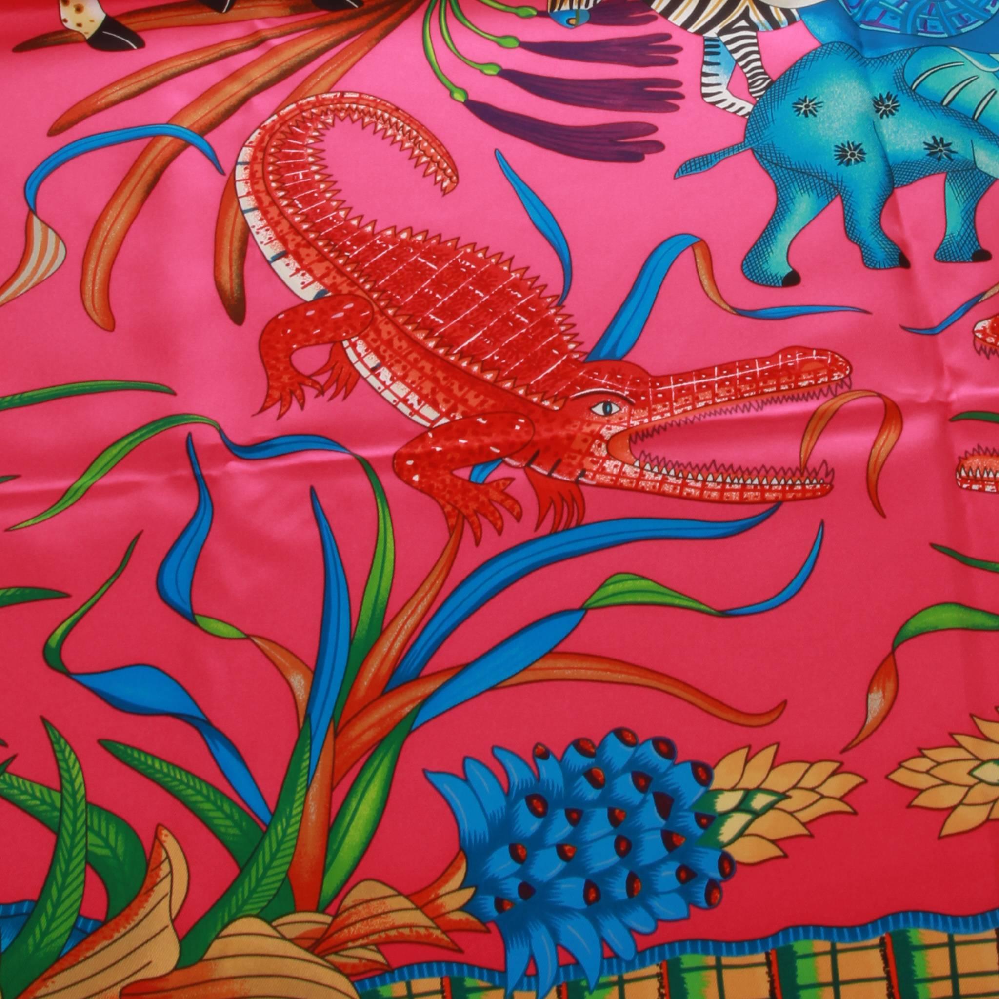 2016 Ardmore X Hermes La Marche du Zambeze silk scarf. In collaboration with South African Ardmore Artists this beautiful silk scarf features imagery of a central desert elephant surrounded by other creatures of Zambezi with indigenous floral motifs
