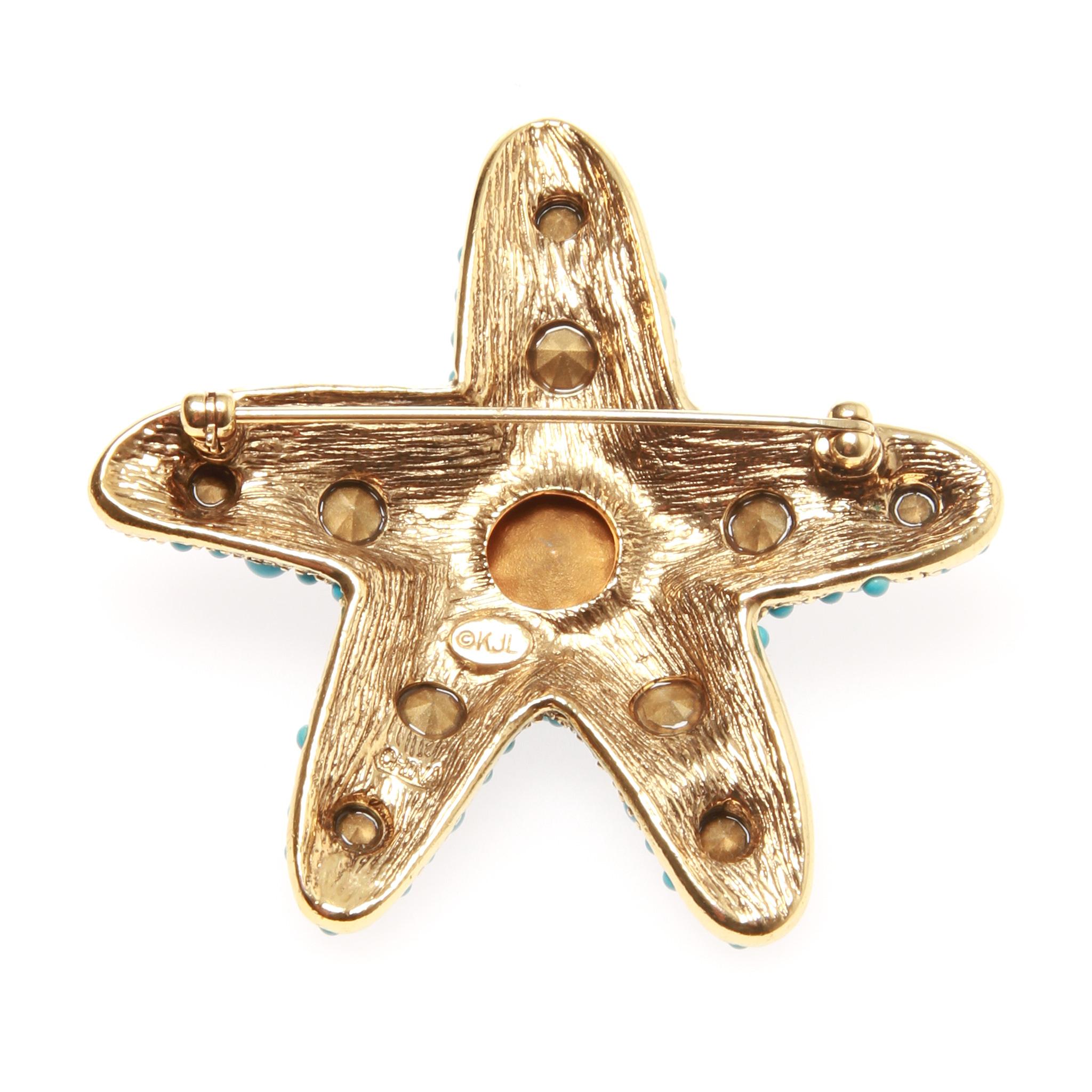 Kenneth Jay Lane Turquoise Starfish Brooch

Charming pin made of metal with turquoise and blue stones inset.
Pin is exceptionally crafted as are all Kenneth Jay Lane pieces.
The reverse has wonderful texture and the KJL signature, one of a kind and