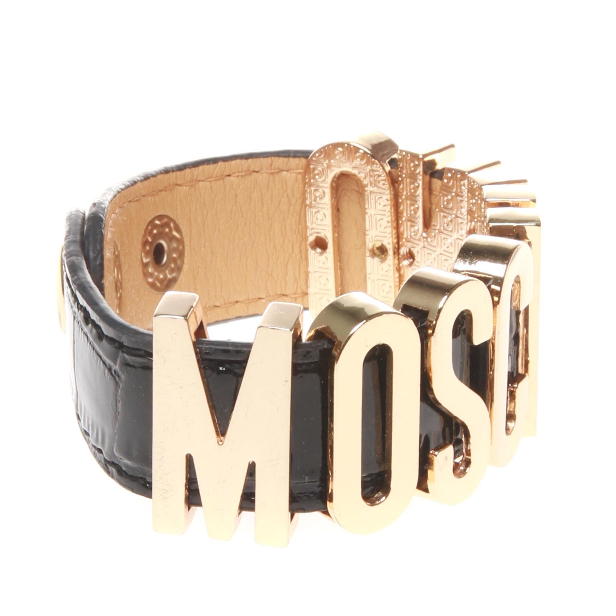 Moschino Black leather cuff with large 'MOSCHINO' letters in gold 