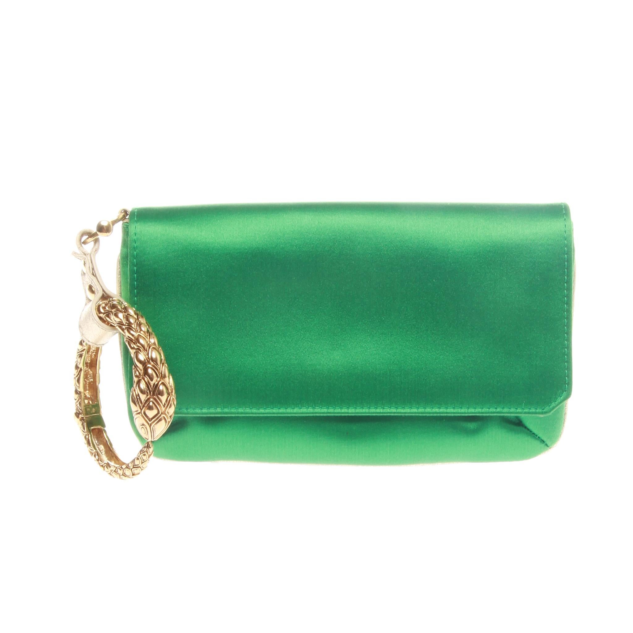 ROBERTO CAVALI SATIN SERPENT BRACELET CLUTCH

This Roberto Cavalli clutch has a fold-over with press stud to fasten, a small zipped pocket on the inside and is fully lined.