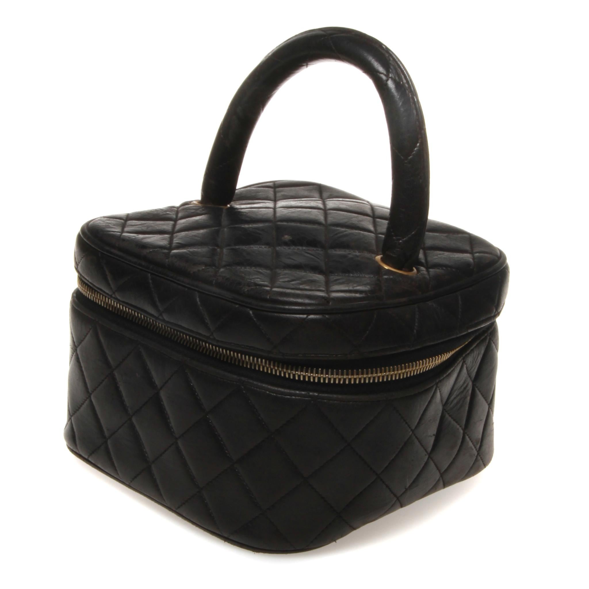 	Chanel makeup case black quilted with gold hardware