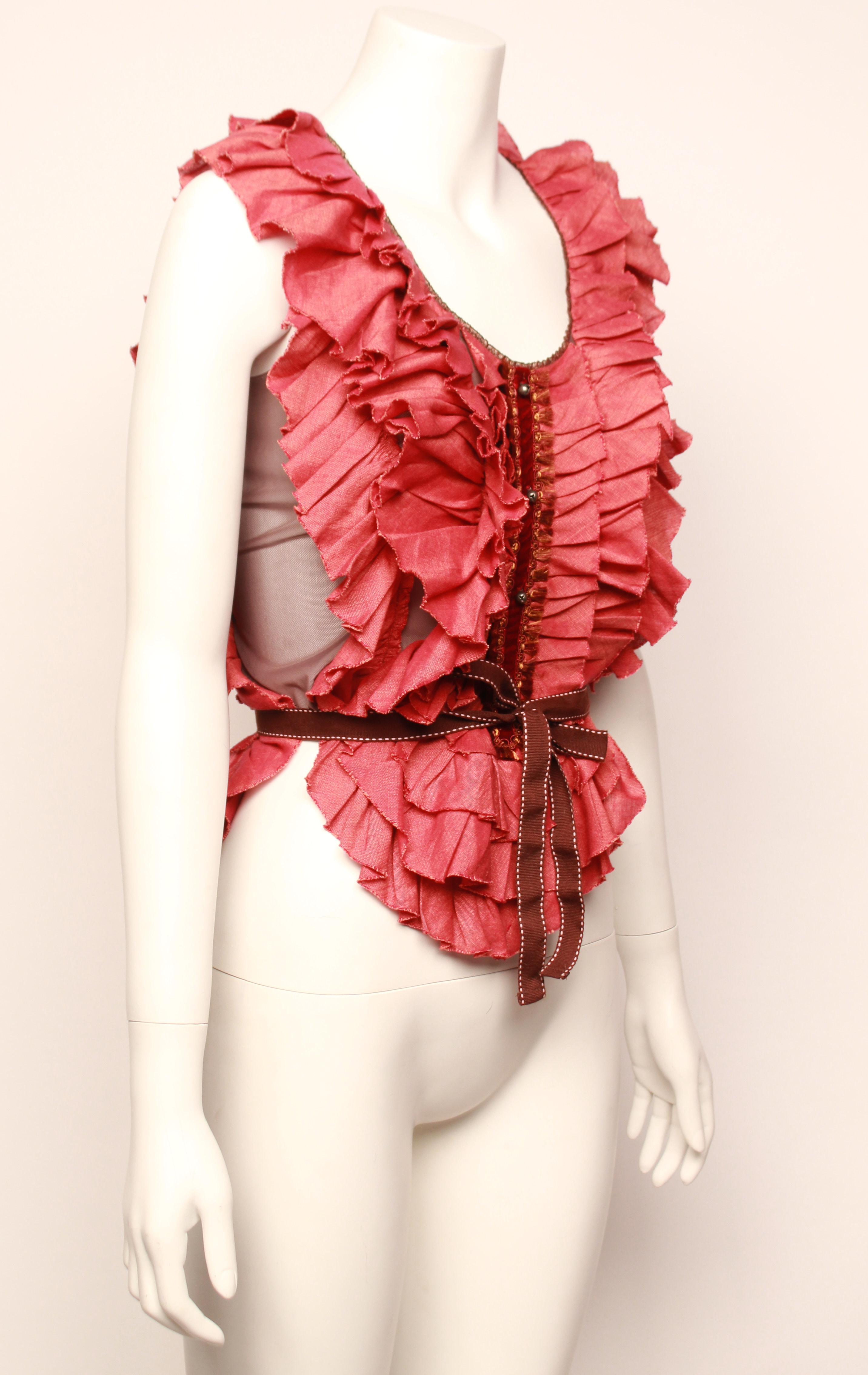 Theatre ruffled bib top with mocha coloured sheer stretch mesh top base with raw edged frills, velvet and braid centre front feature and cute decorative bells. 
Grosgrain ribbon waist tie. Size label has been removed but would fit across small to