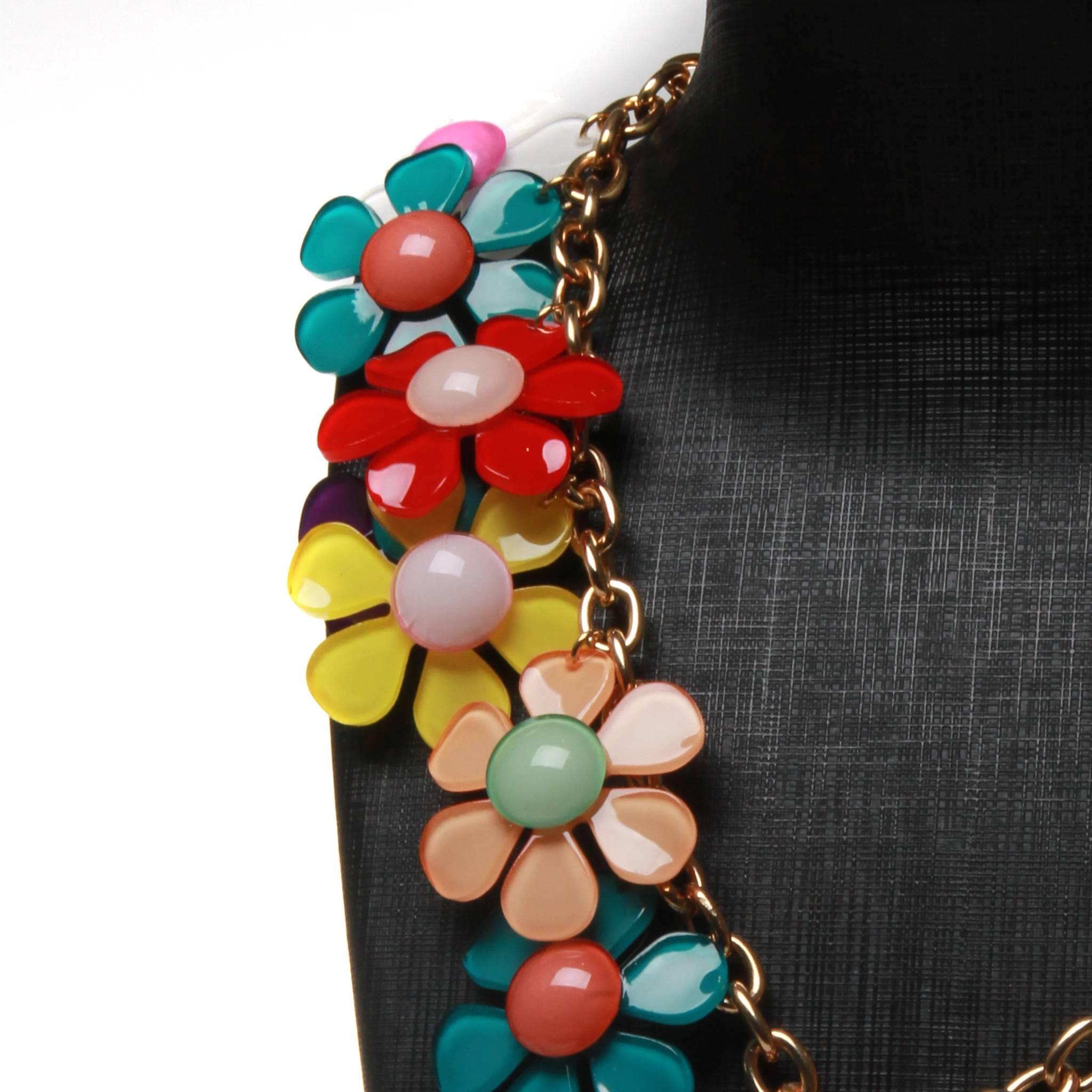 This stunning necklace is an impossible to find piece.  A true investment piece from the fashion guru himself. 
Guaranteed to brighten your day, you will love wearing this eye-catching necklace. 
The flowers are in beautiful bright colours and