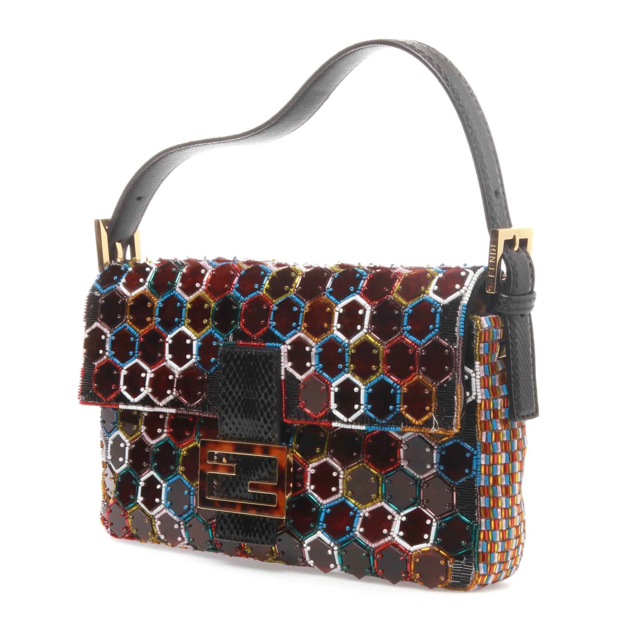 Fendi Resort 2015 Baguette Bag featuring a multicoloured beading and plexiglass hexagon motif. The bag is accented with black python leather and gold detailing and a tortoiseshell logo plate. 

The inside is lined with lime green fabric and comes