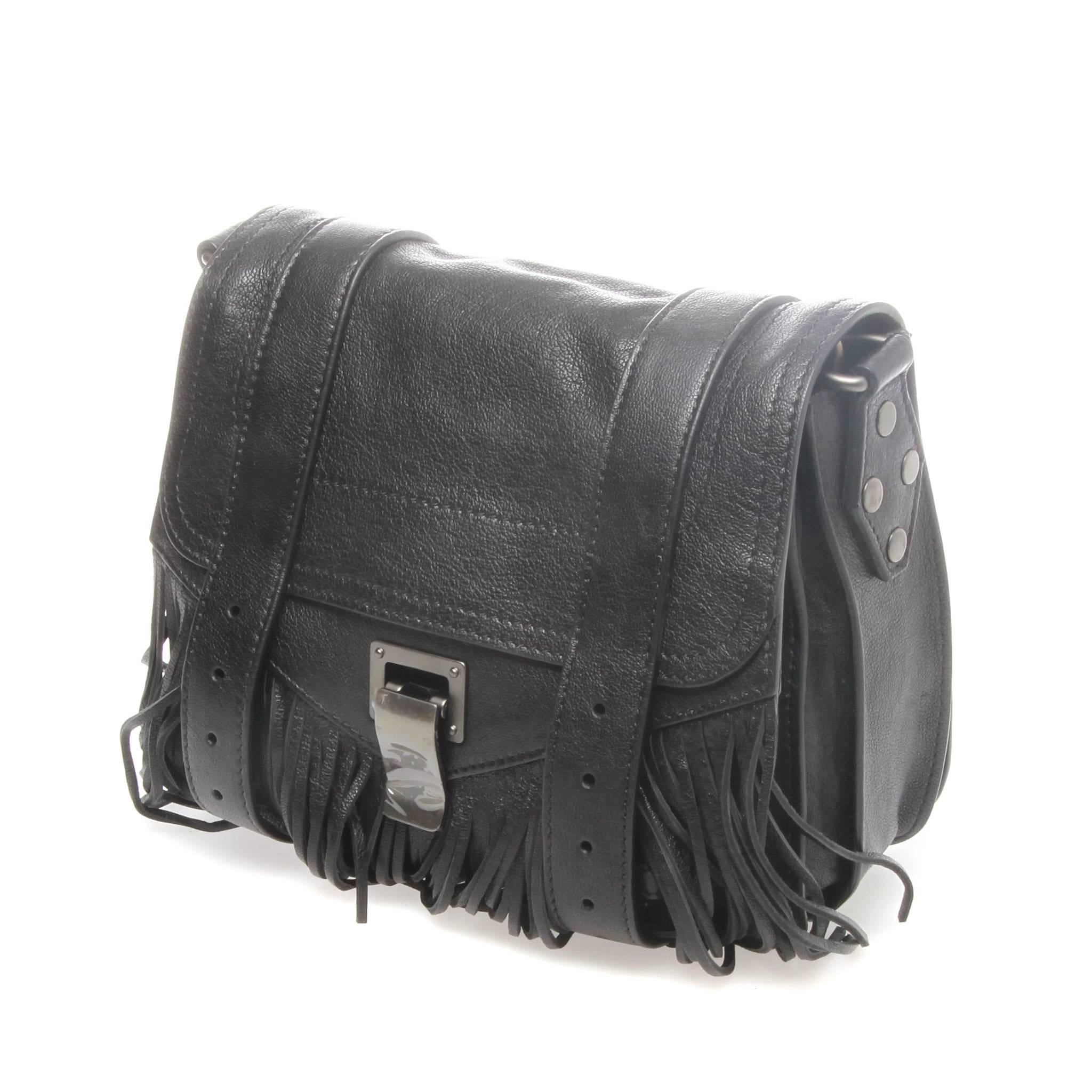 Proenza Schouler's iconic PS1 satchel tunes into a bohemian beat with this fringed leather iteration. Black leather Proenza Schouler PS1 mini crossbody bag with gunmetal hardware, detachable flat shoulder strap, single zip pocket at back, single
