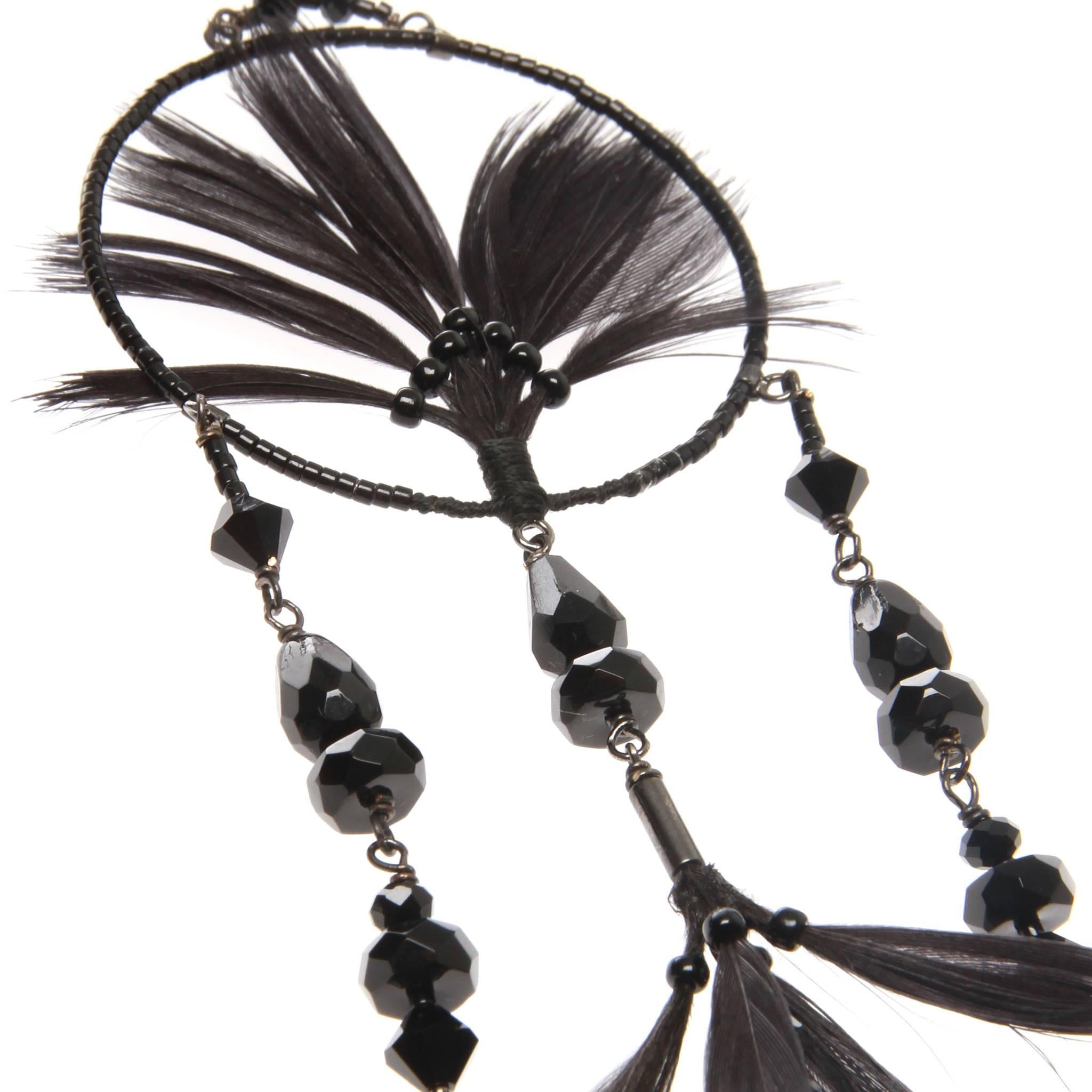 Beautiful Valentino Garavani earrings from Resort 2016. 

Crafted from sleek ruthenium-tone brass and hand-embellished with black duck feathers, shimmering glass and crystal beads. 

Fastening: Butterfly for pierced ears. 

Comes with authentic and